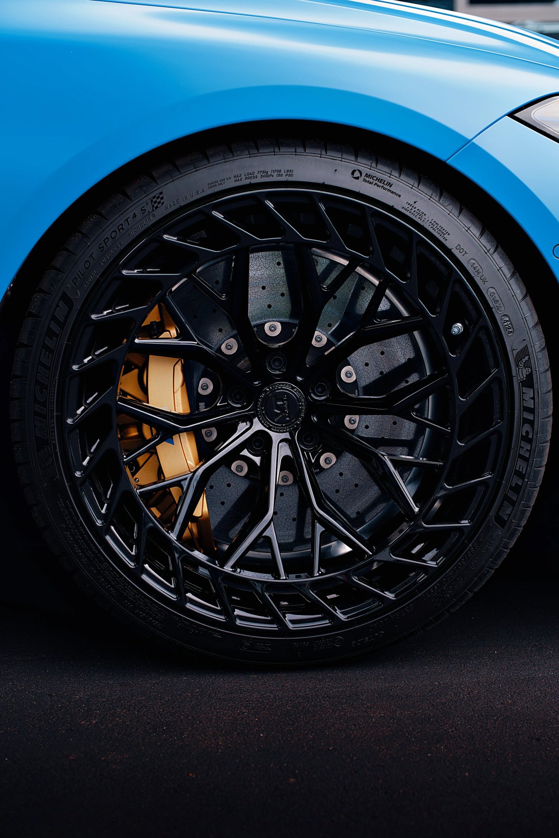 Electric blue BMW M3 Competition XDrive car photography at 704 Exotics in Charlotte, North Carolina.