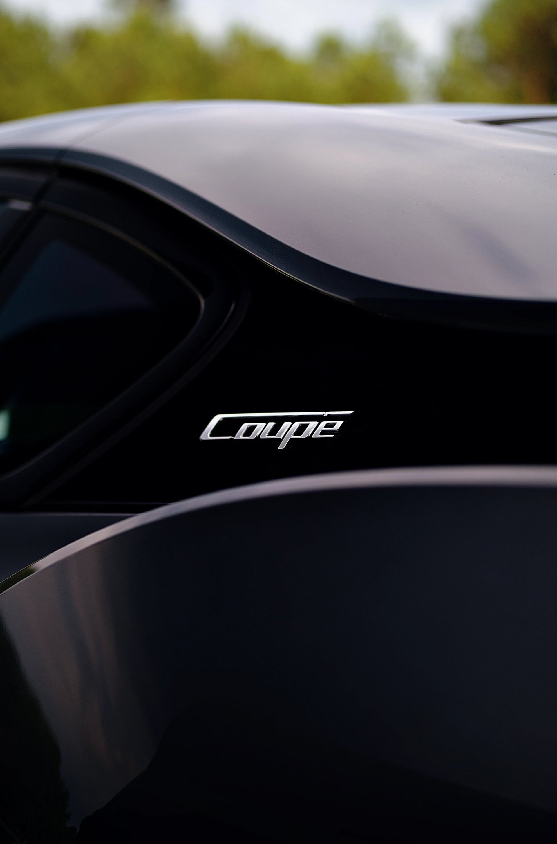 Sleek, black, and elegant BMW Coupe car photos taken at 704 Exotics in Charlotte, North Carolina.