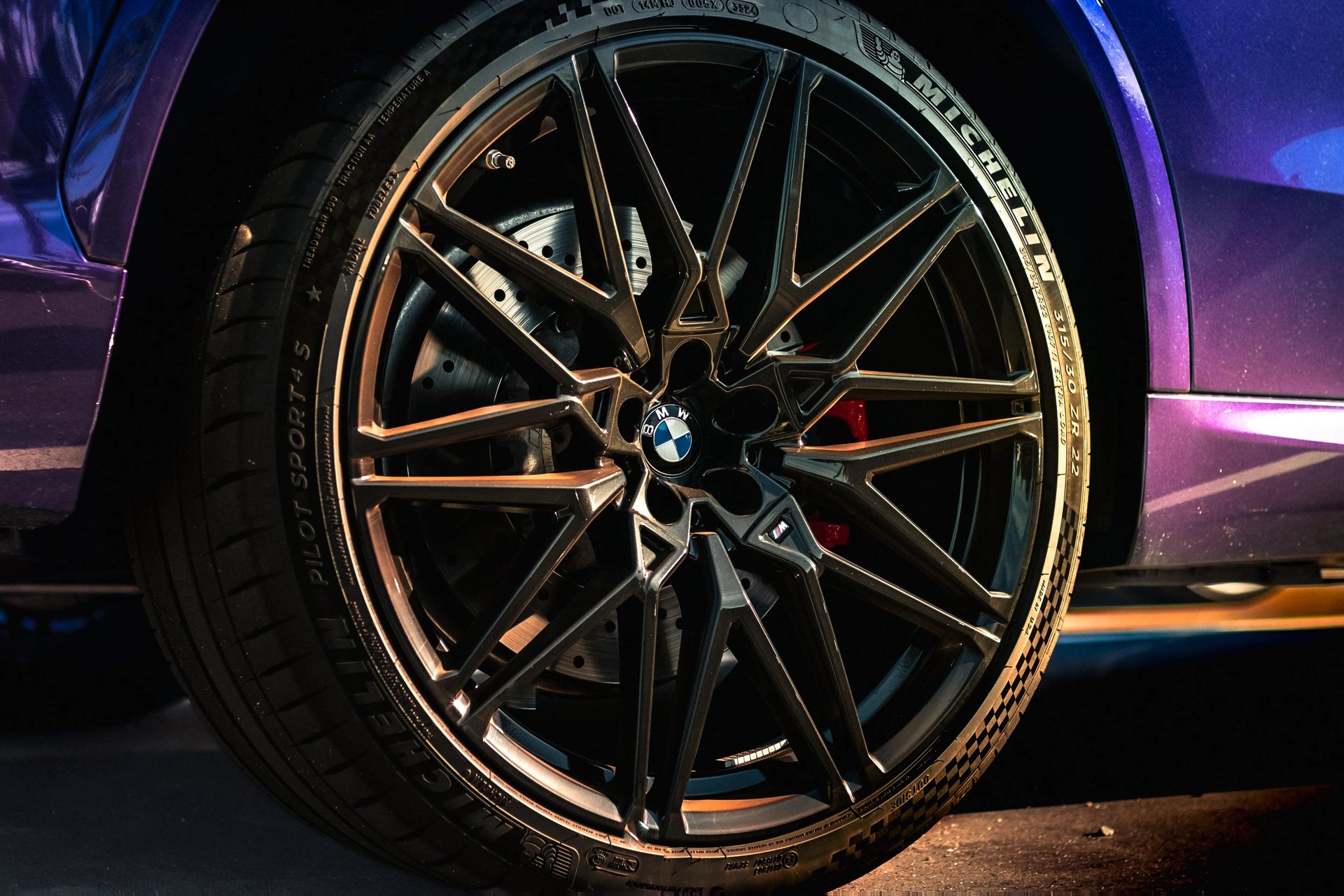 Electric blue BMW M3 Competition XDrive car photography at 704 Exotics in Charlotte, North Carolina.