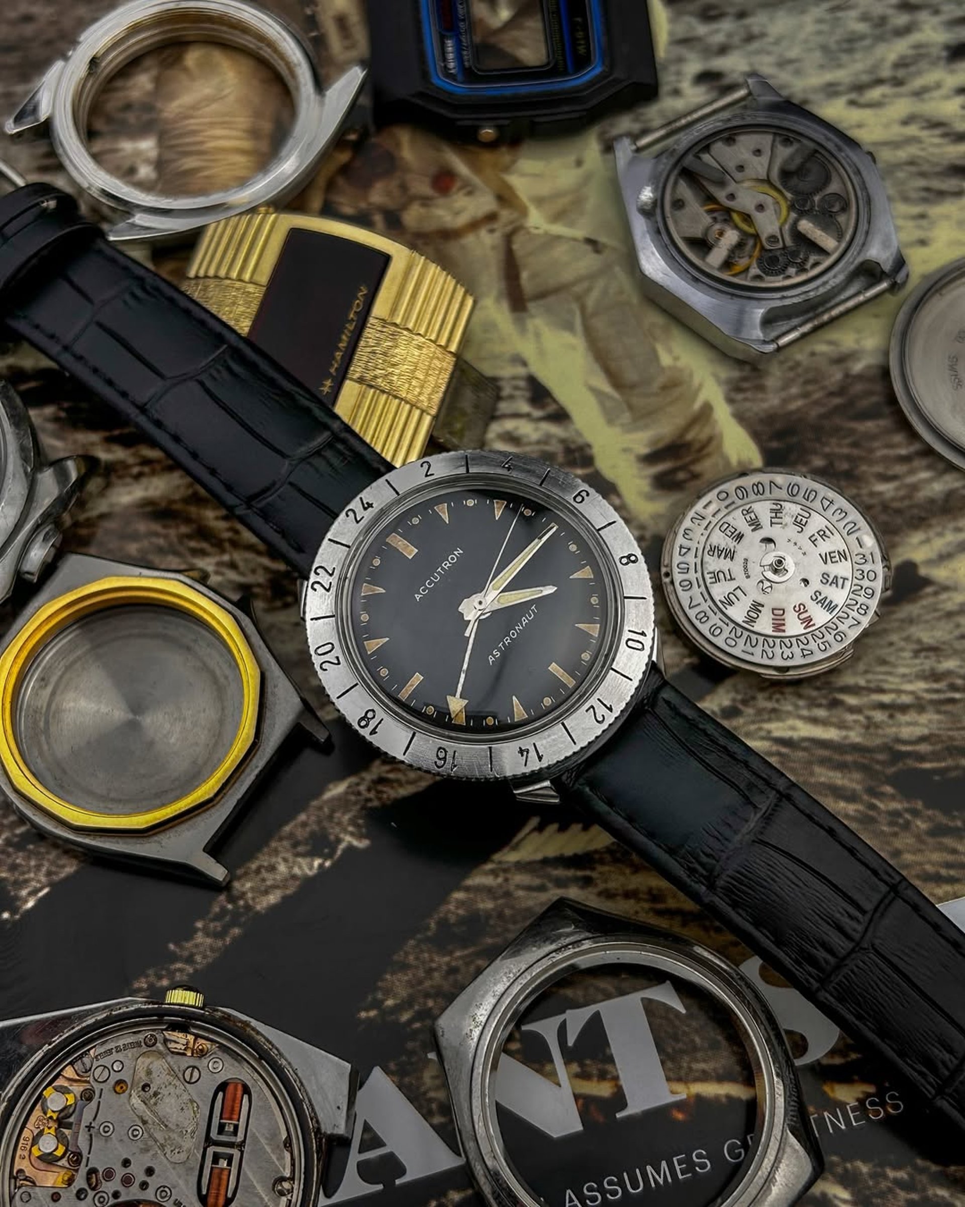 a watch sitting on top of a brown case