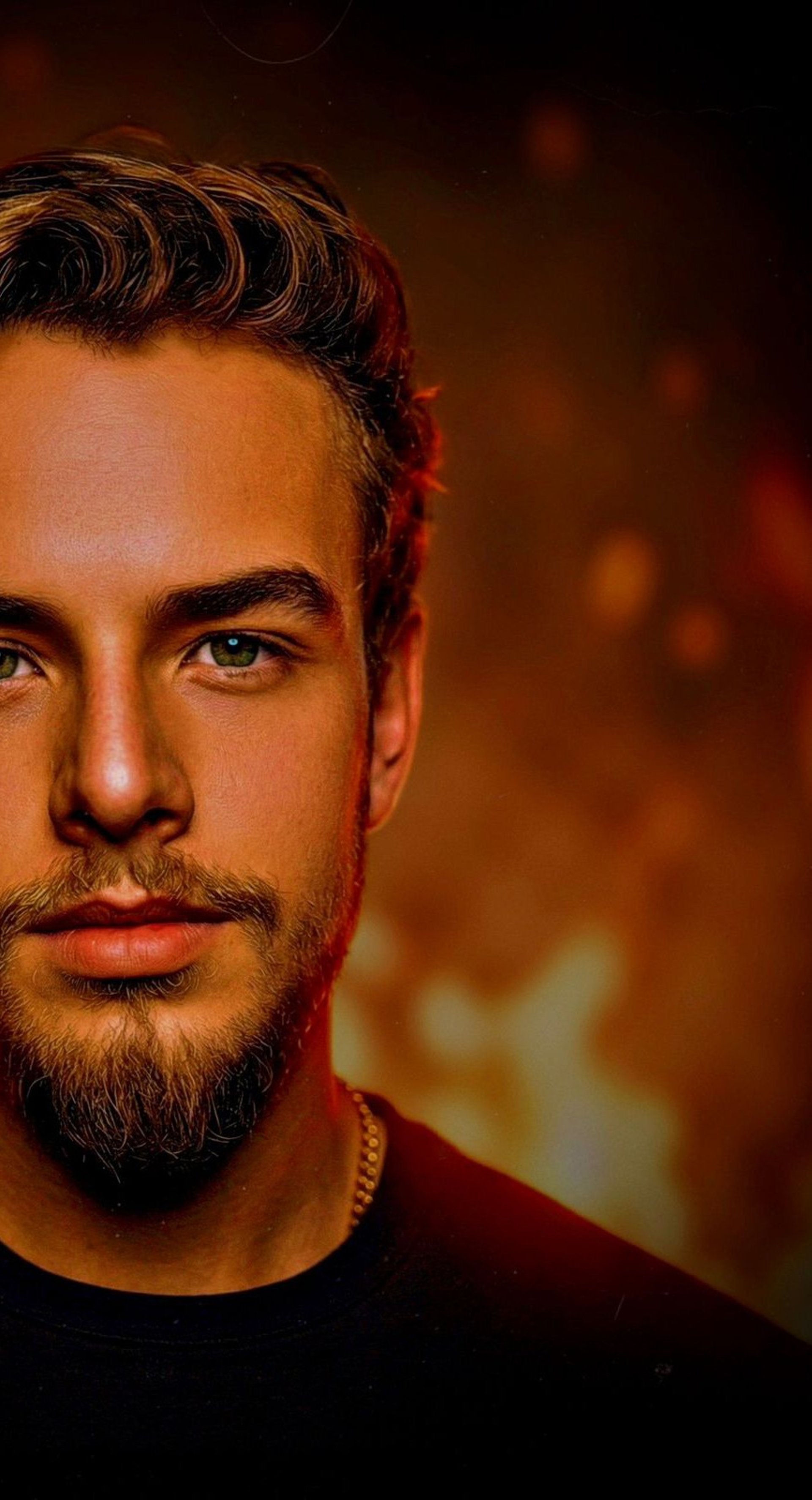 person holding amber glass bottle