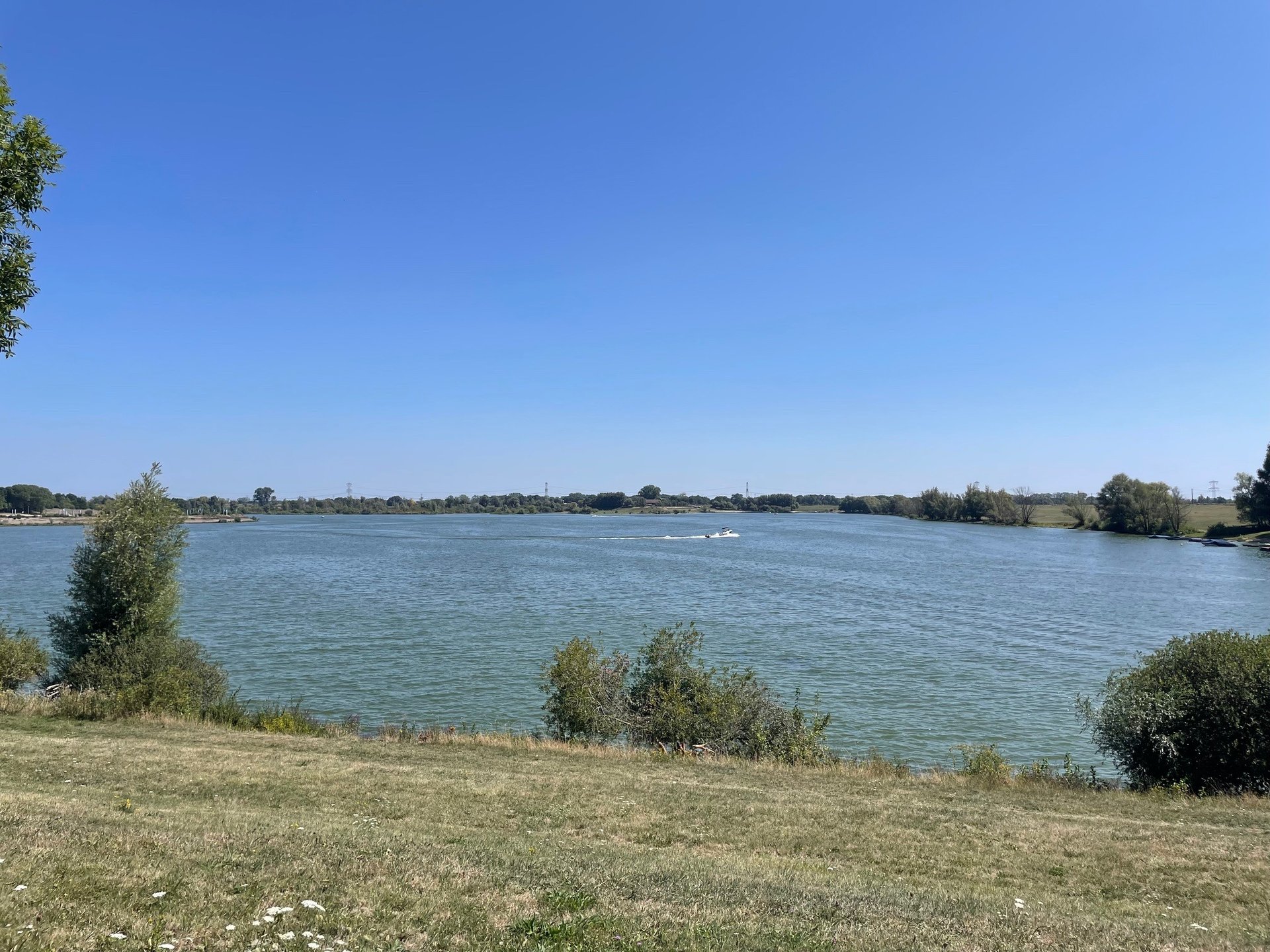 woman wearing yellow long-sleeved dress under white clouds and blue sky during daytime