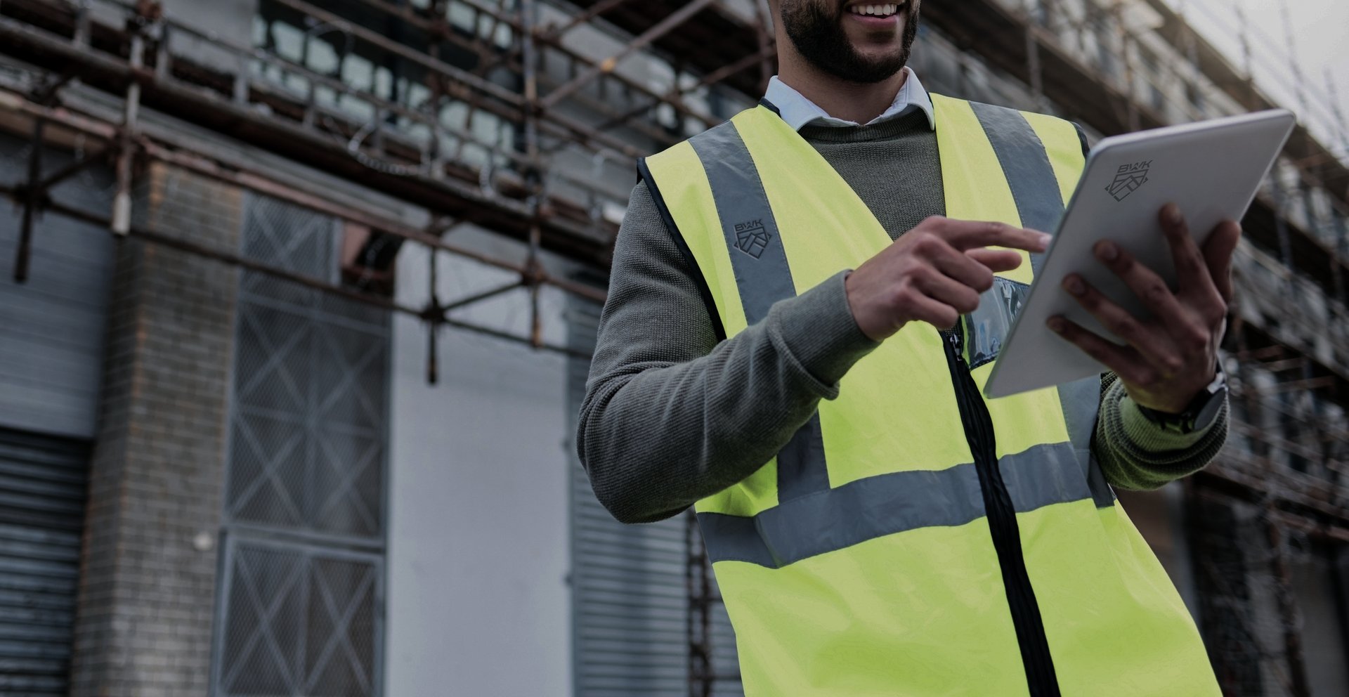 an abstract photo of a curved building with a blue sky in the background