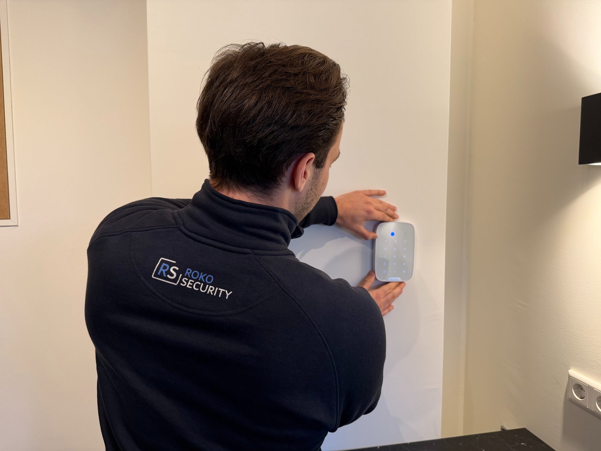 Couple sitting on floor surrounded by moving boxes