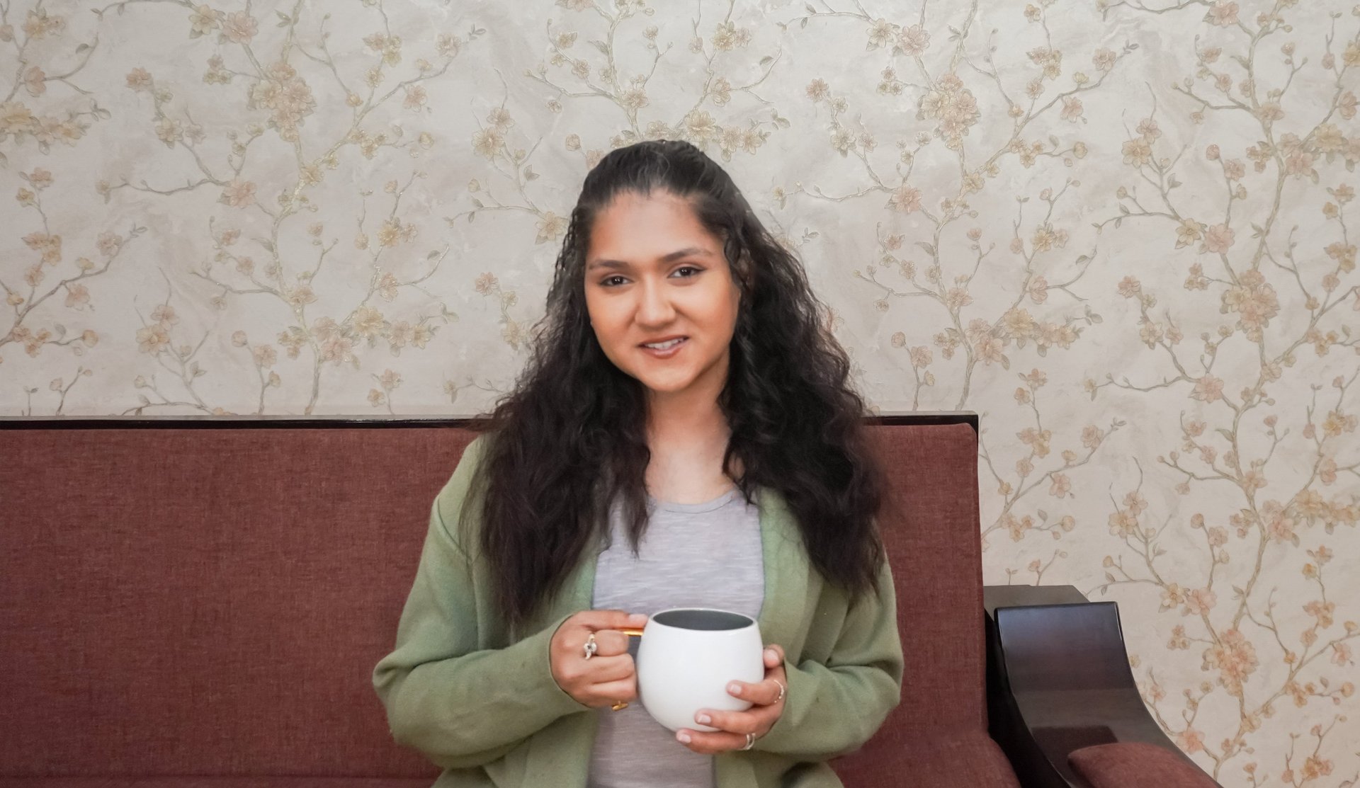 woman in white and brown dress standing on green grass during night time