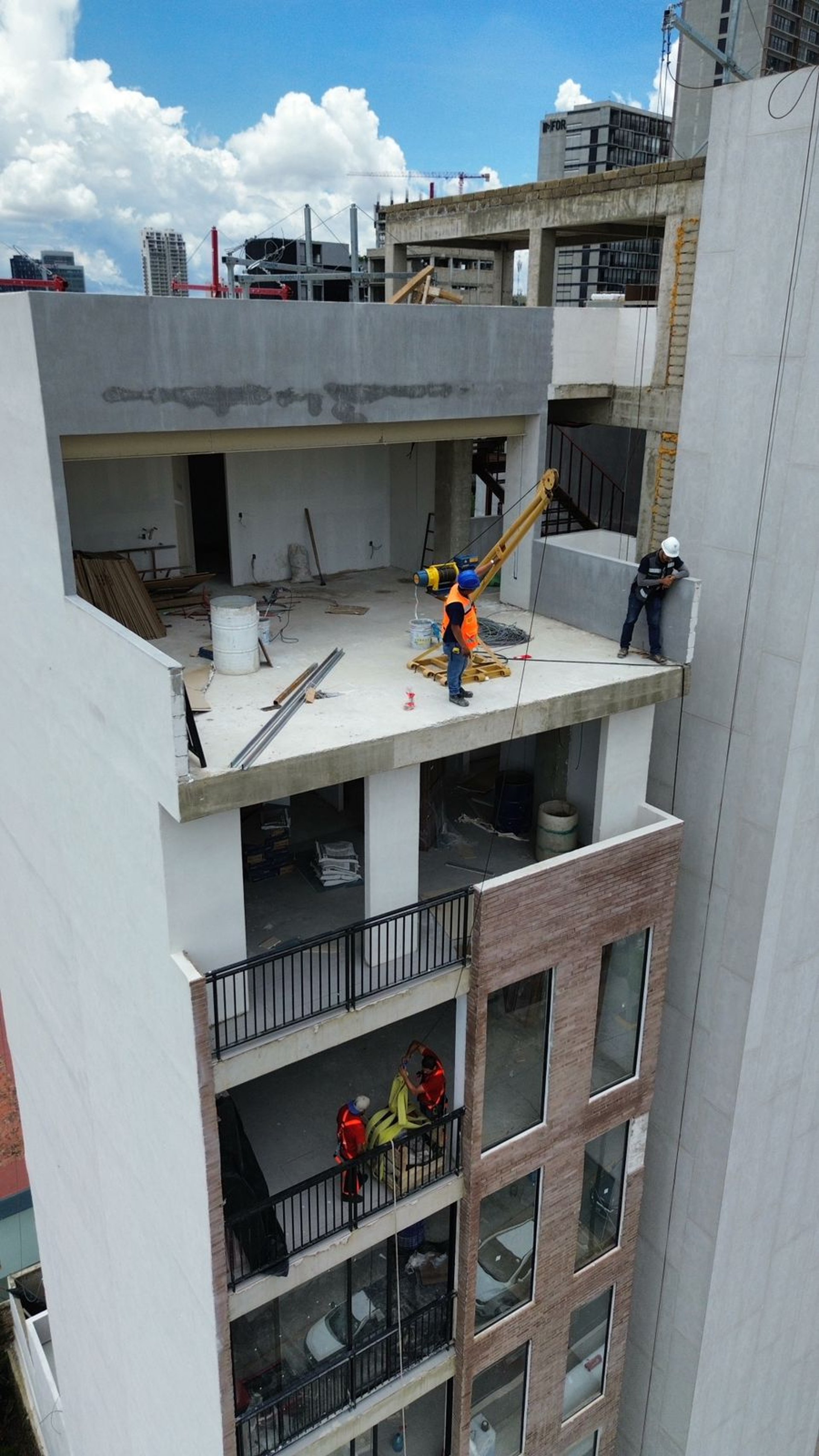 woman wearing yellow long-sleeved dress under white clouds and blue sky during daytime