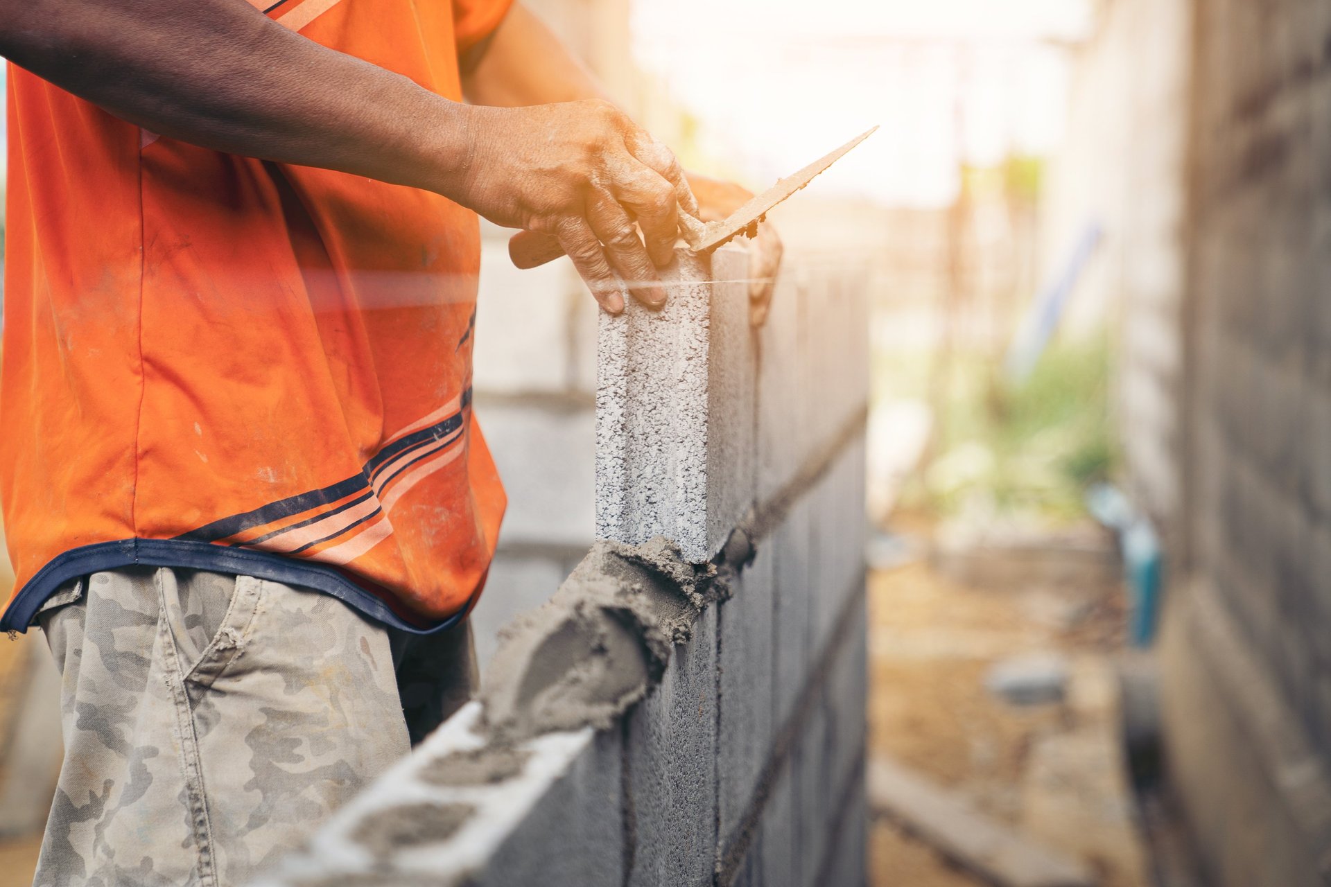 a man using a grinder on a piece of concrete