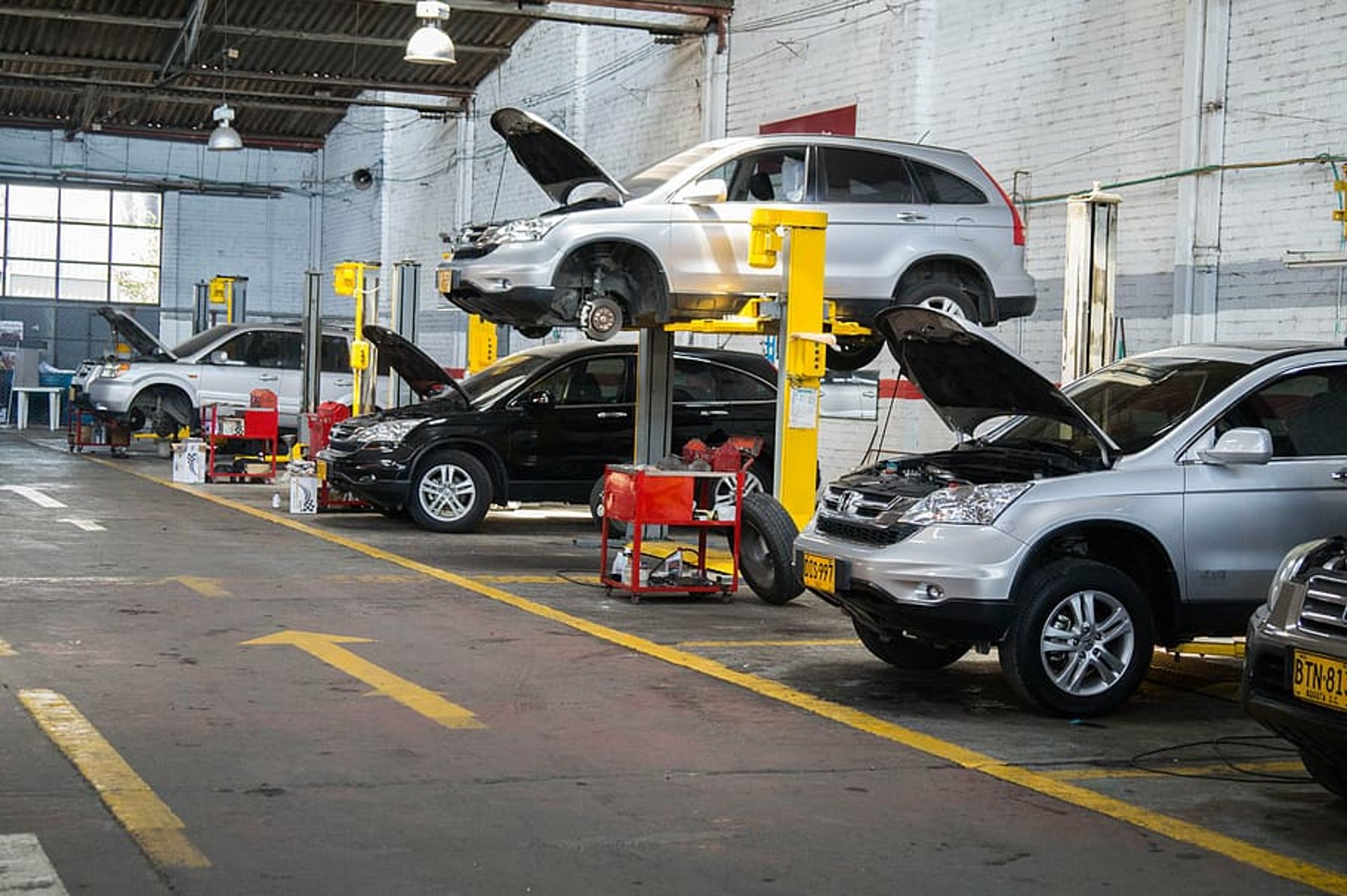 woman wearing yellow long-sleeved dress under white clouds and blue sky during daytime