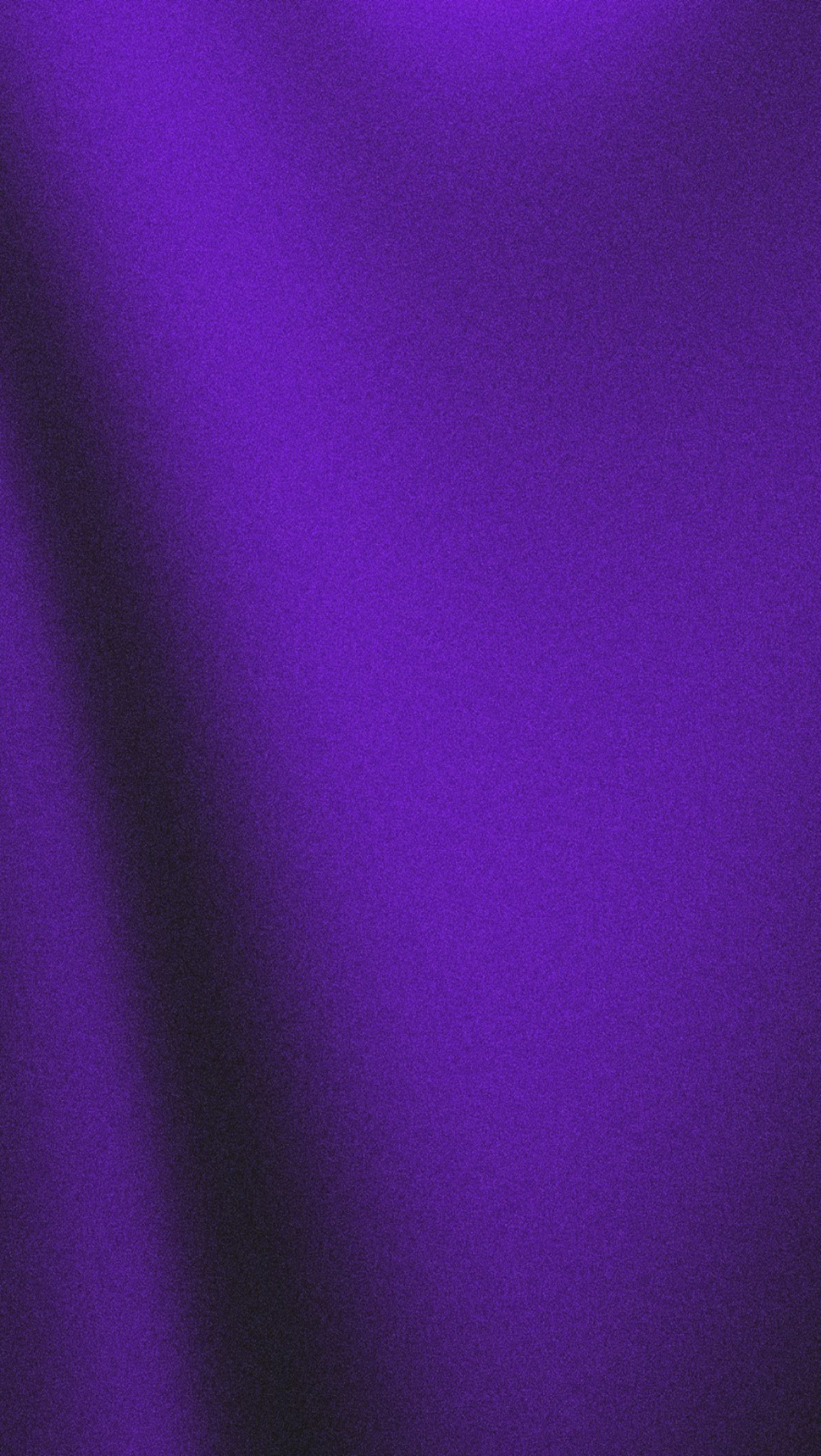 A close up of a cell phone on a black background