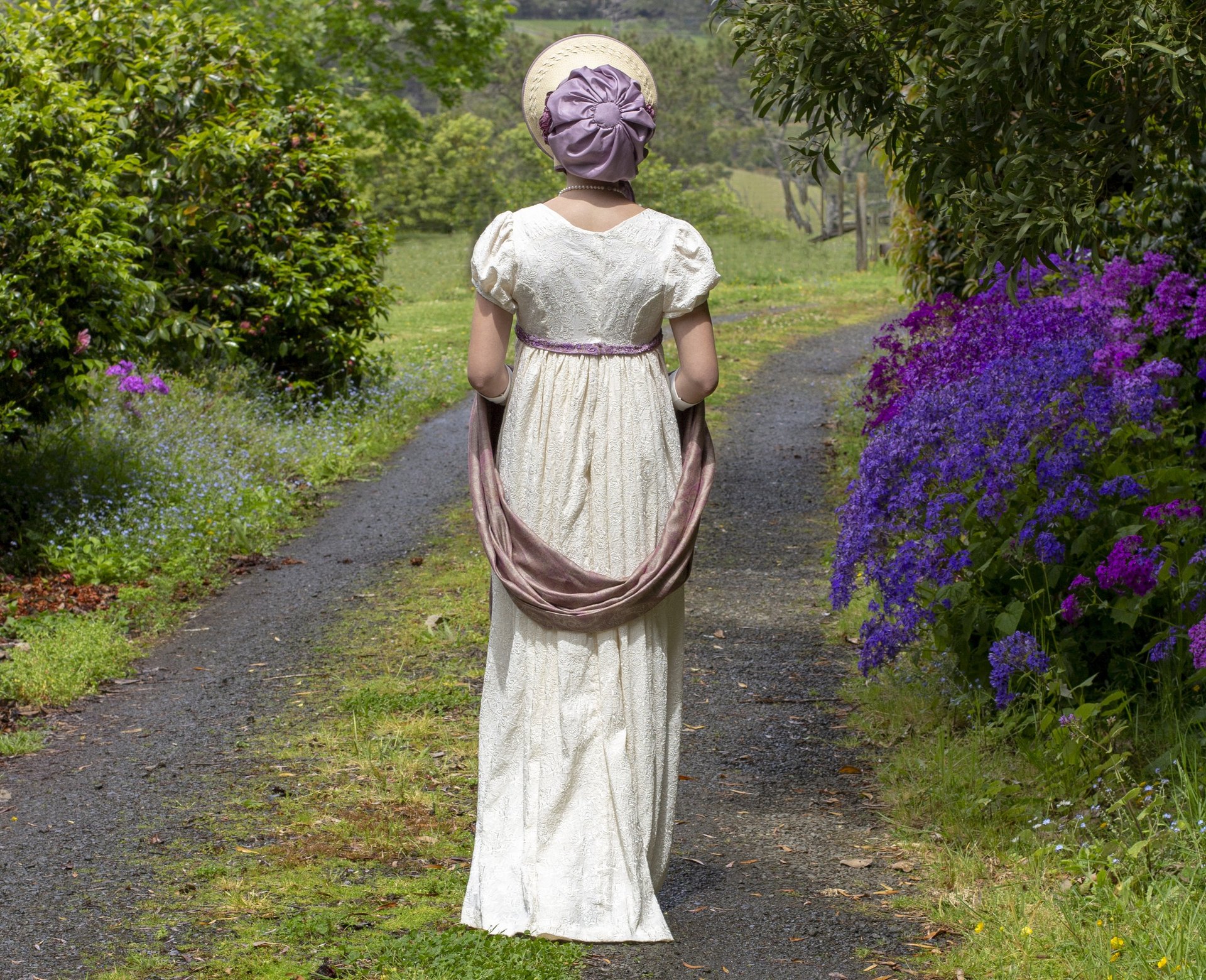 woman wearing yellow long-sleeved dress under white clouds and blue sky during daytime