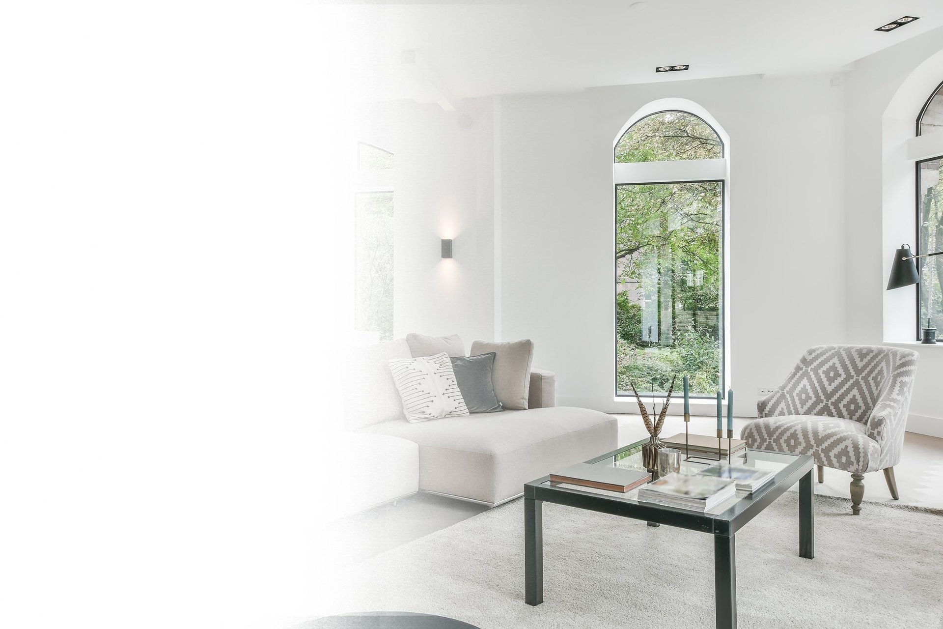 a living room filled with furniture and a large window