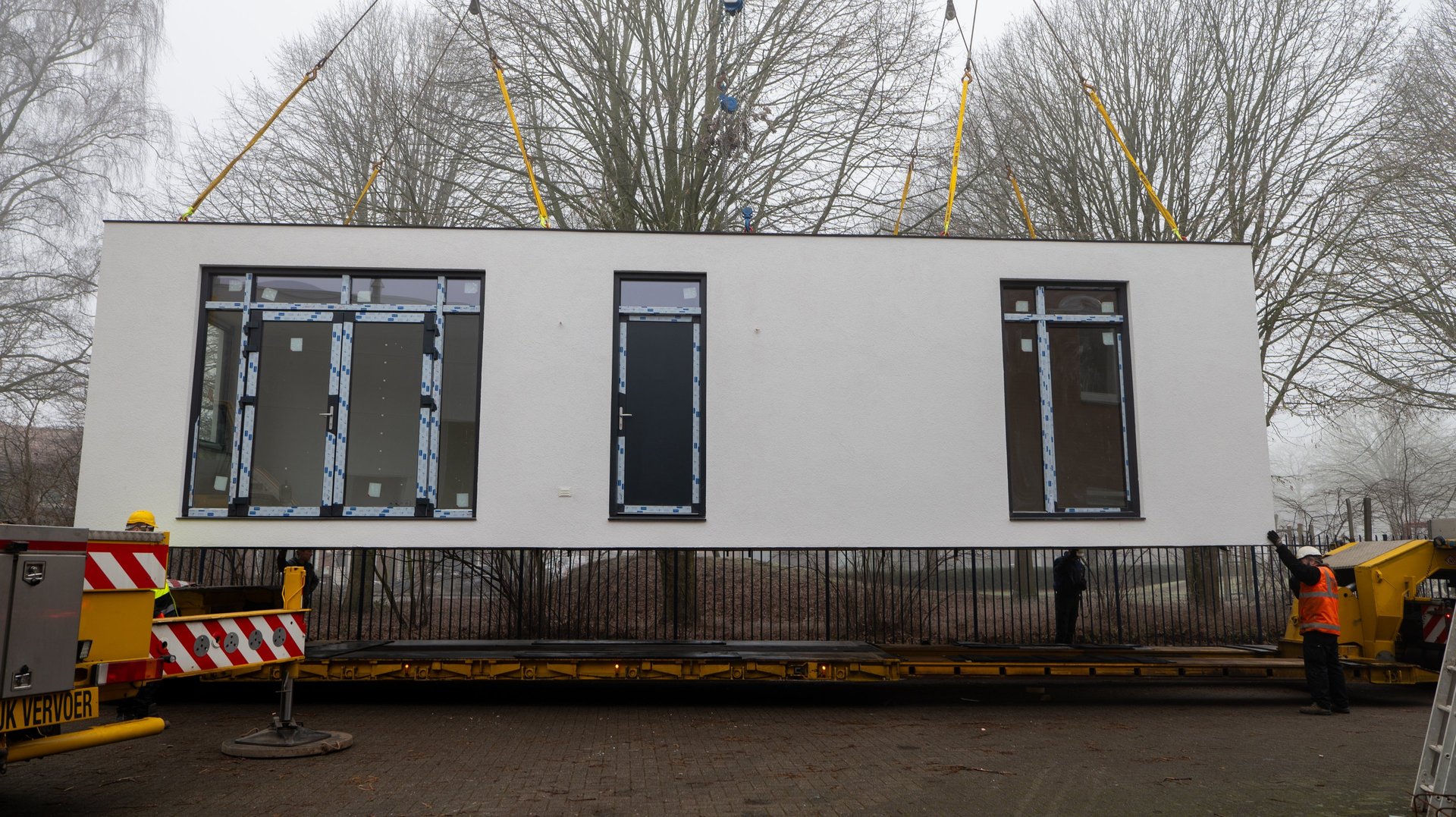 an abstract photo of a curved building with a blue sky in the background