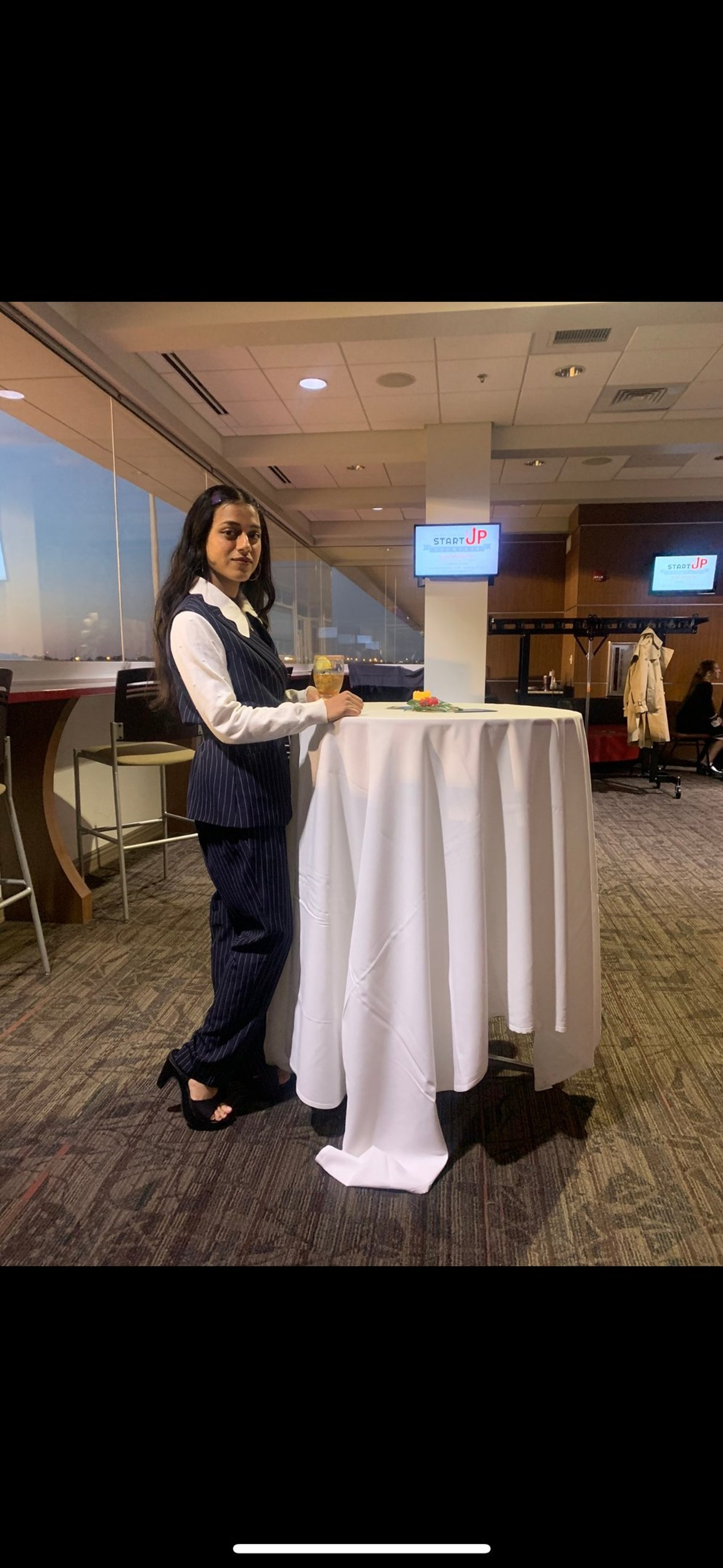 an abstract photo of a curved building with a blue sky in the background
