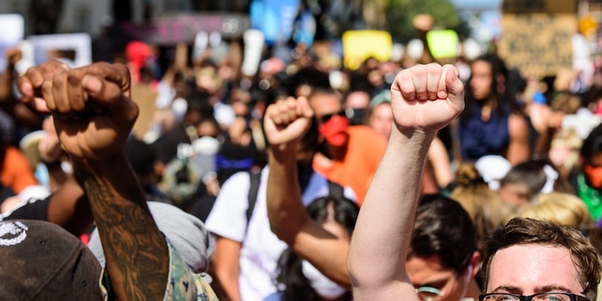 woman wearing yellow long-sleeved dress under white clouds and blue sky during daytime