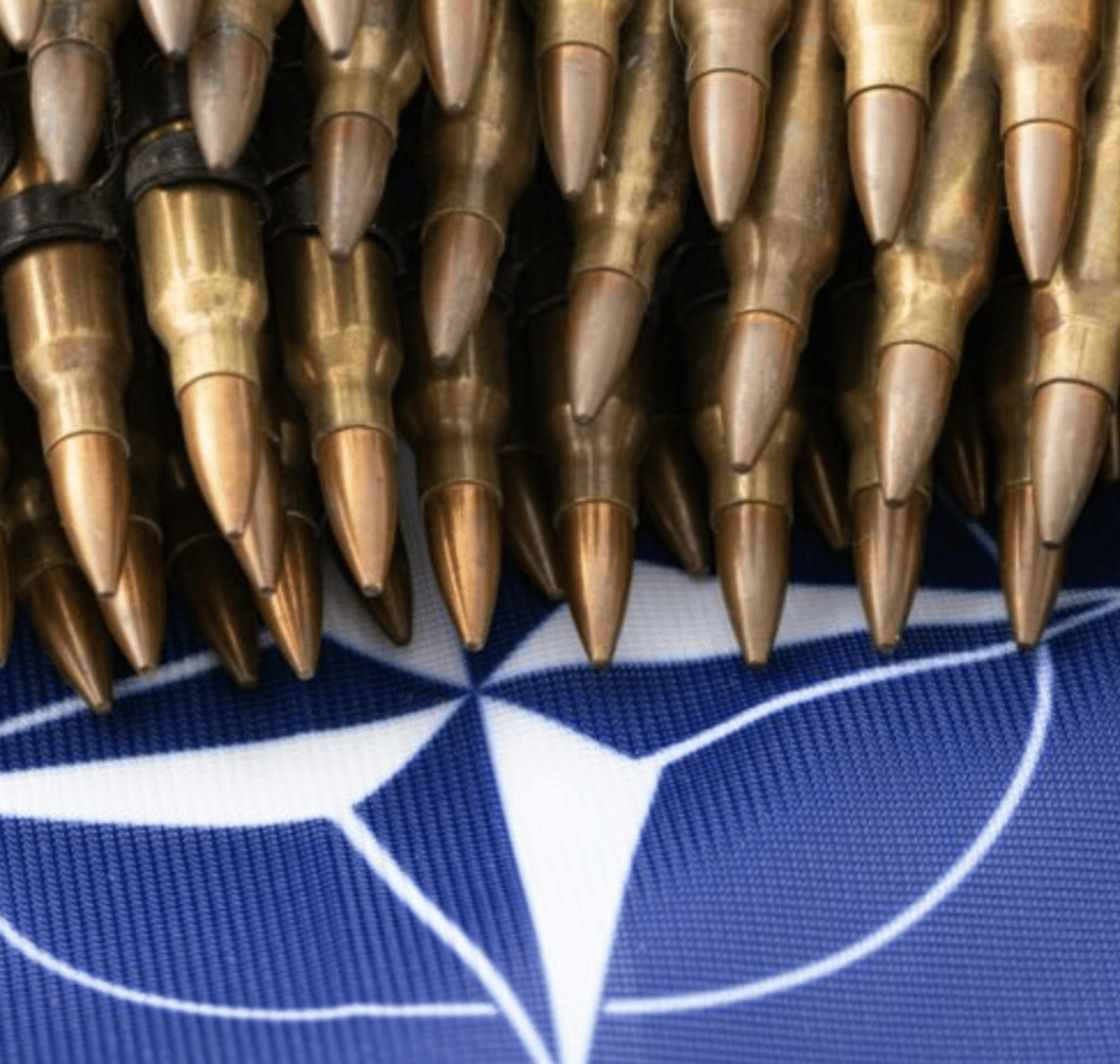 an abstract photo of a curved building with a blue sky in the background