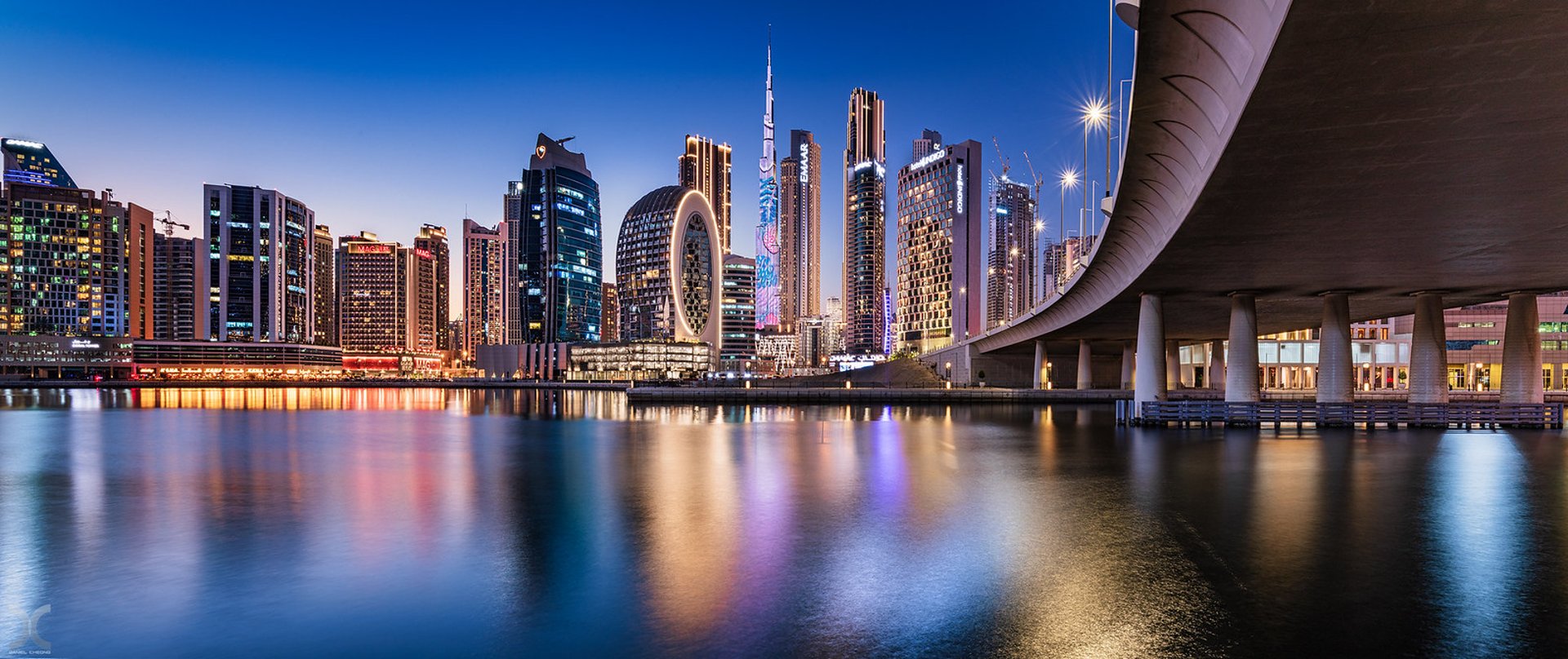 woman wearing yellow long-sleeved dress under white clouds and blue sky during daytime
