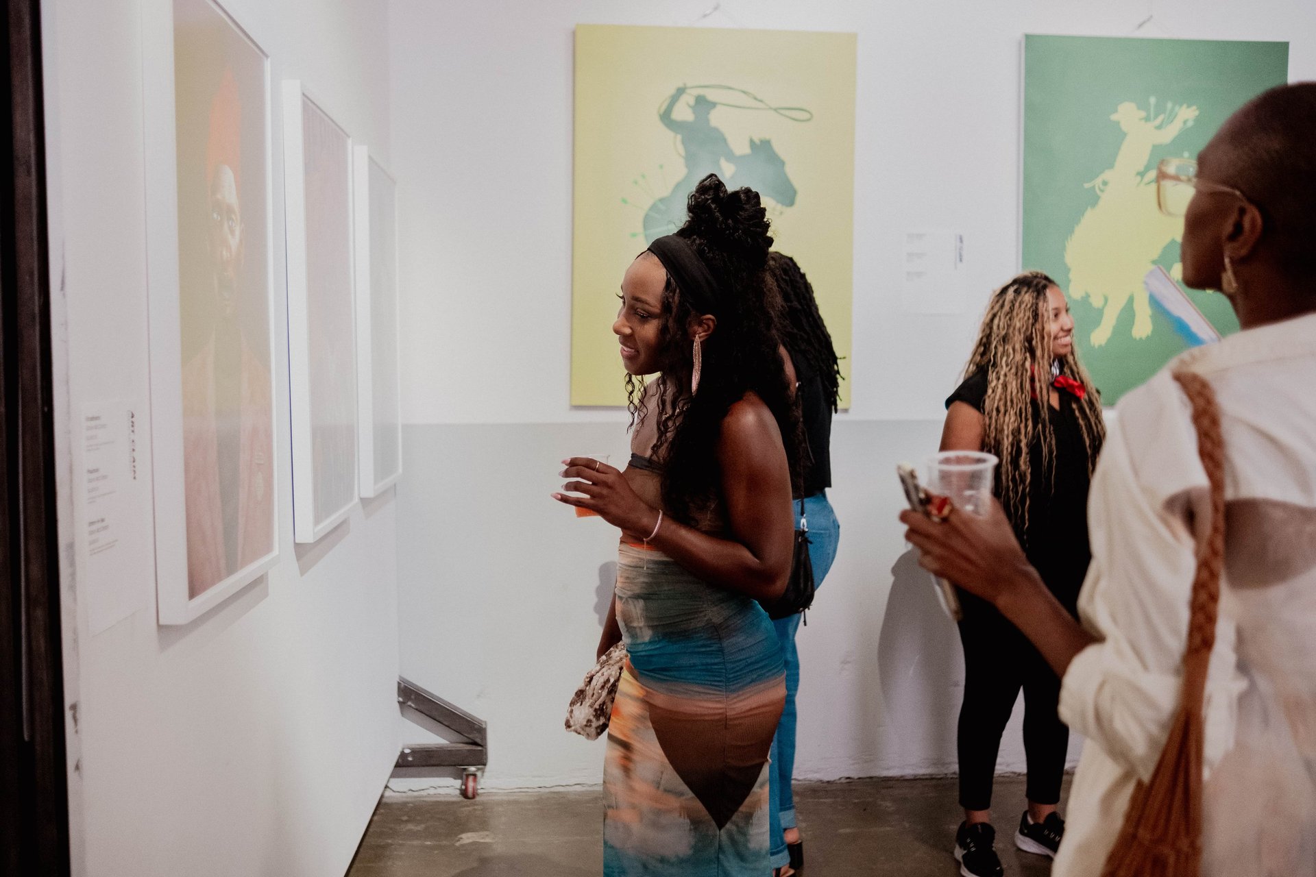 silhouette of airplane flying over the people during sunset