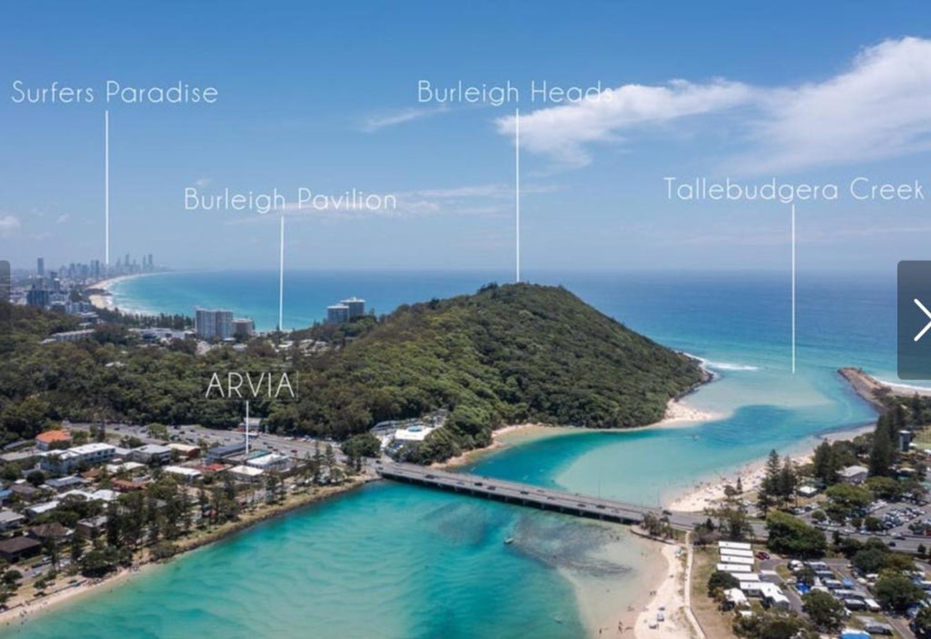 an abstract photo of a curved building with a blue sky in the background