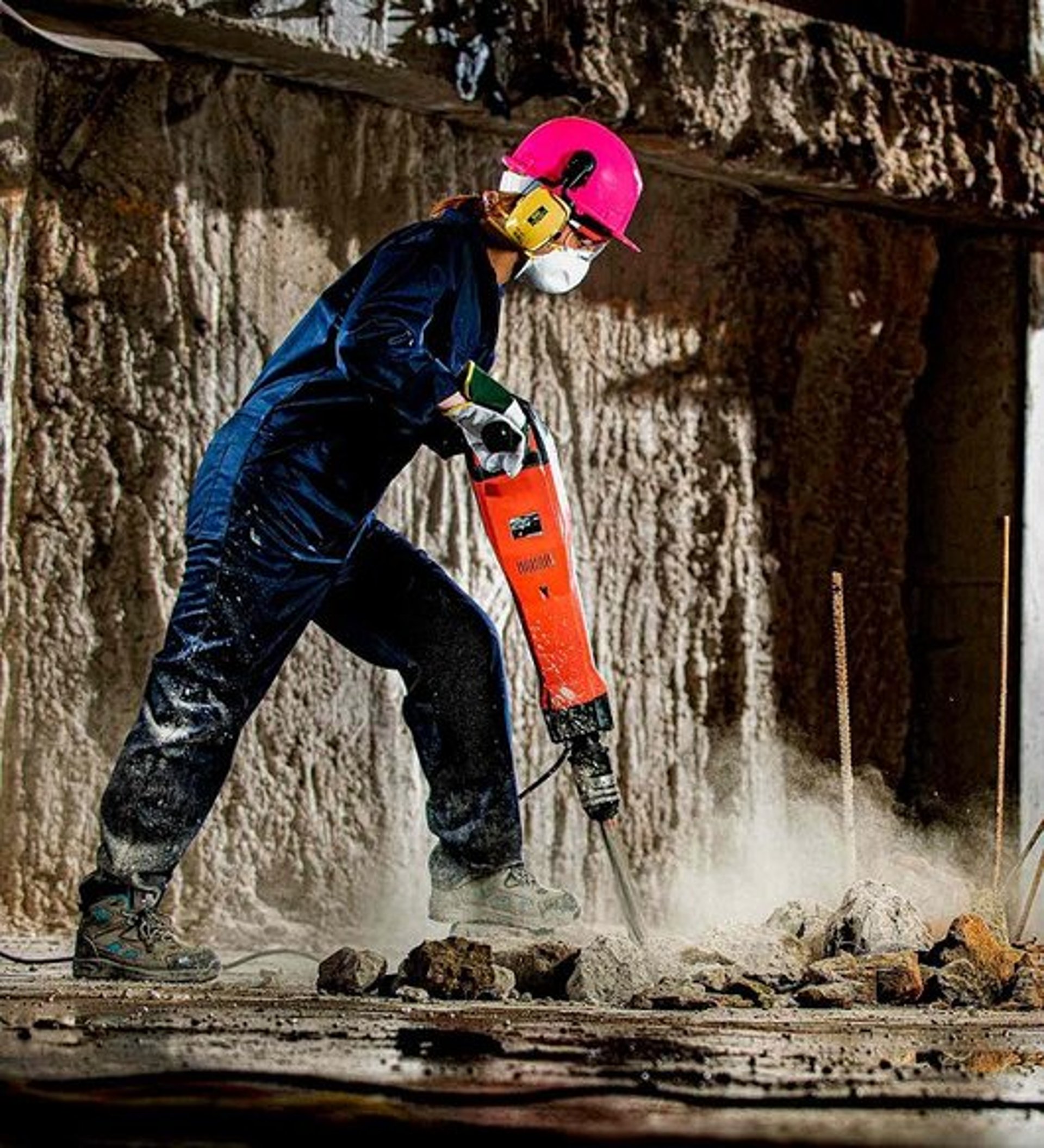 a man using a grinder on a piece of metal