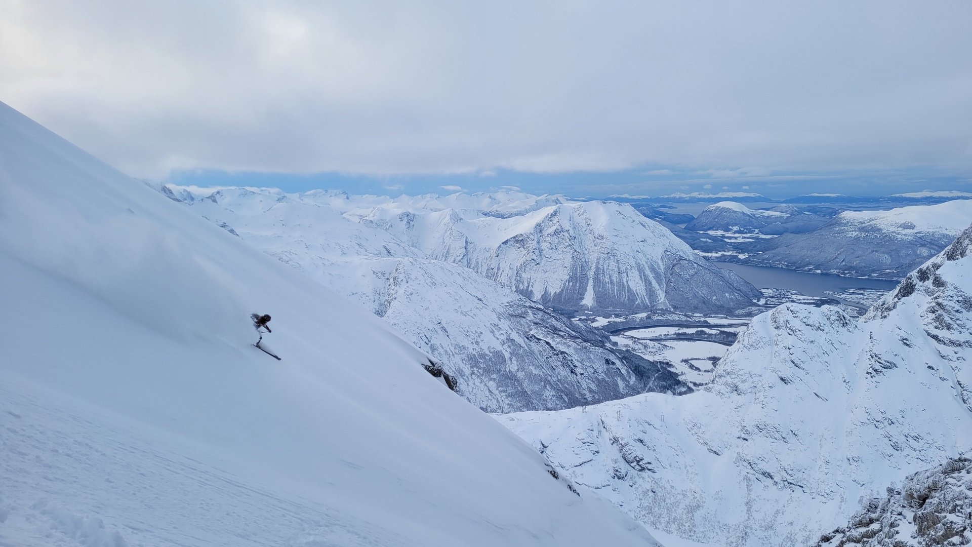 woman wearing yellow long-sleeved dress under white clouds and blue sky during daytime