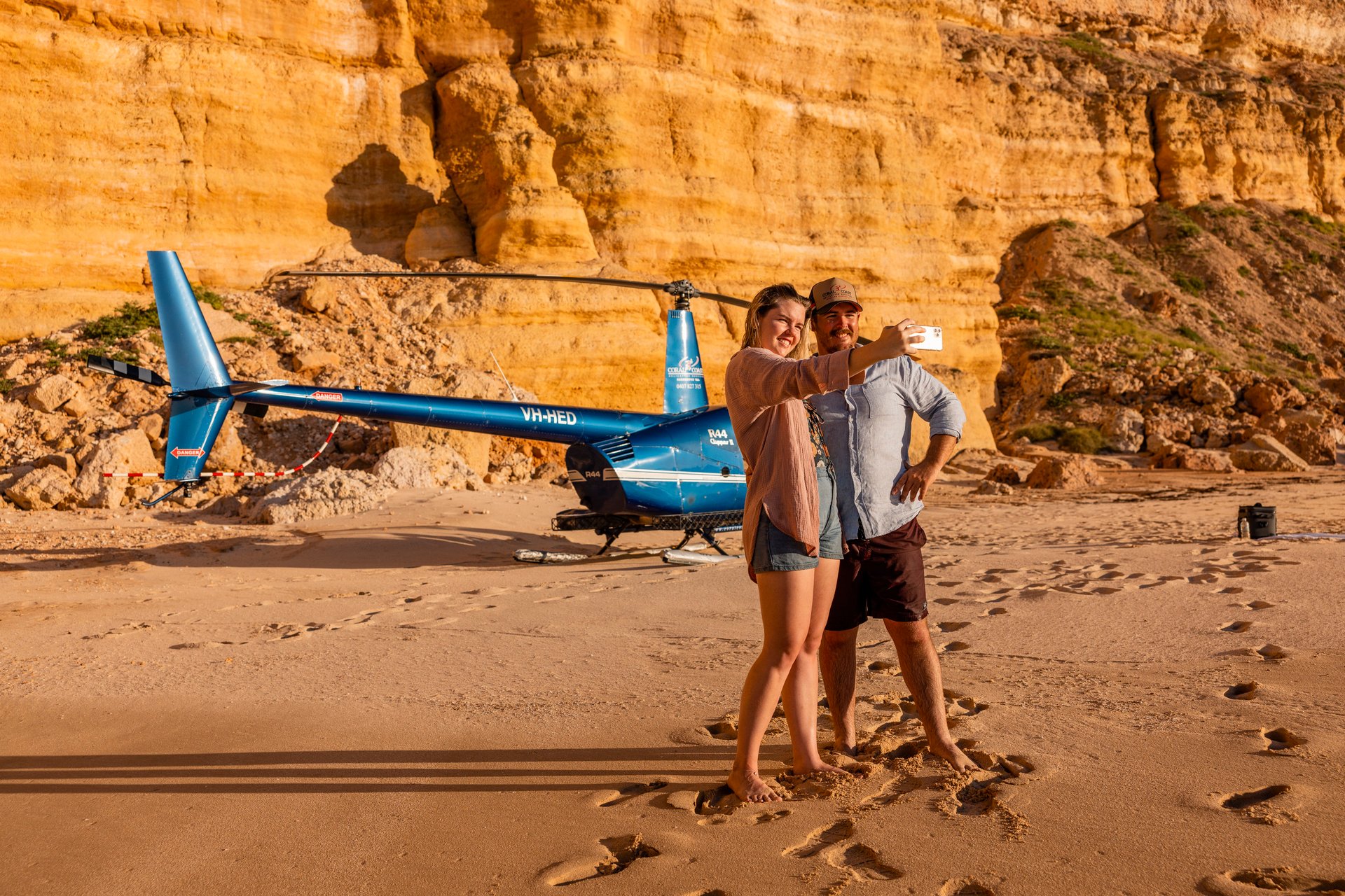 woman wearing yellow long-sleeved dress under white clouds and blue sky during daytime
