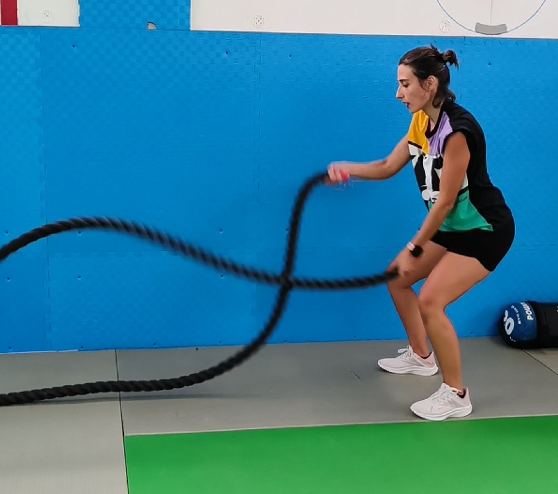 an abstract photo of a curved building with a blue sky in the background