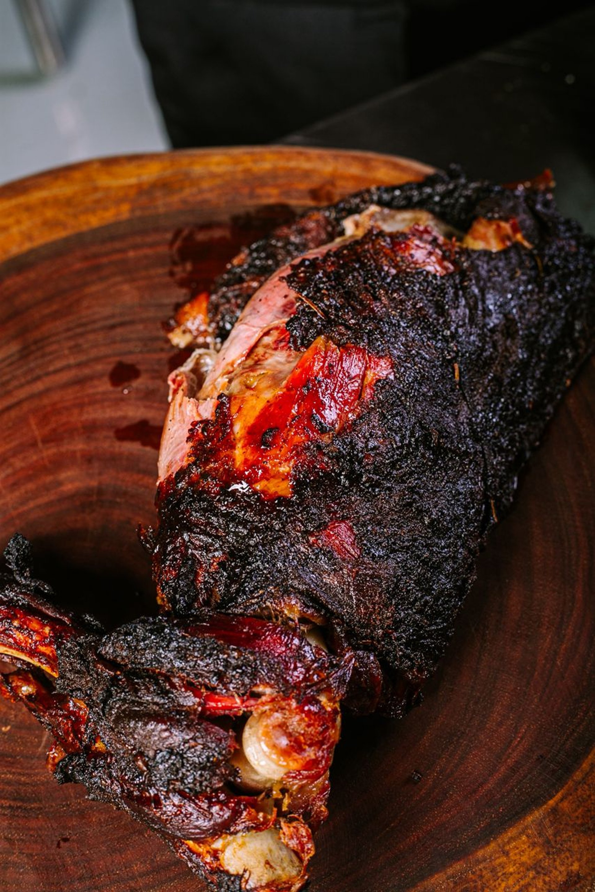 a cooked chicken sitting on top of a metal rack