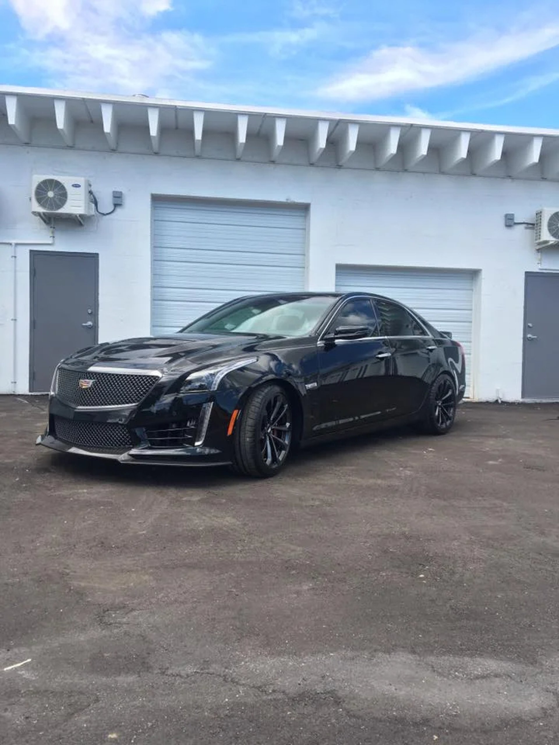 black and brown leather padded tub sofa