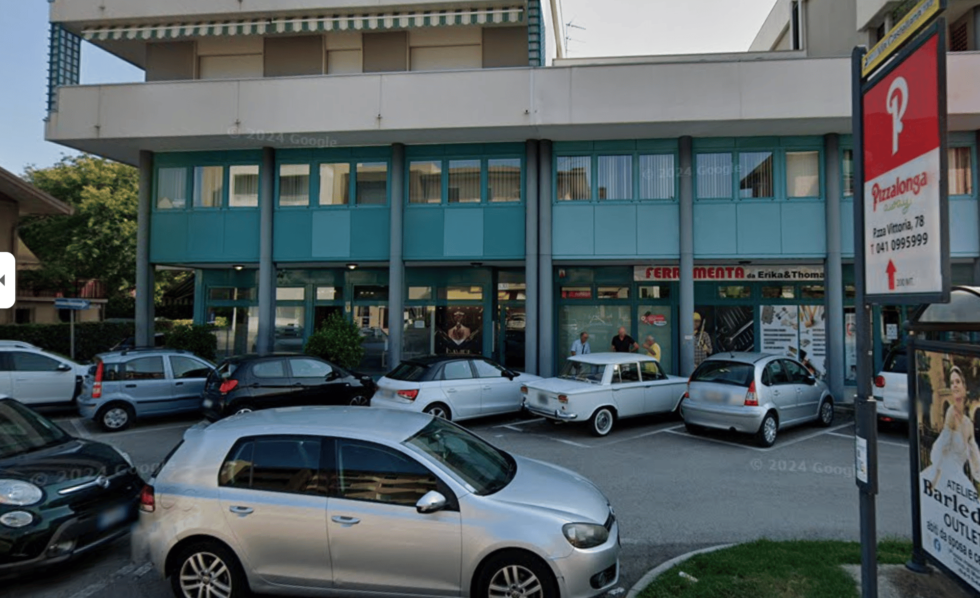 an abstract photo of a curved building with a blue sky in the background