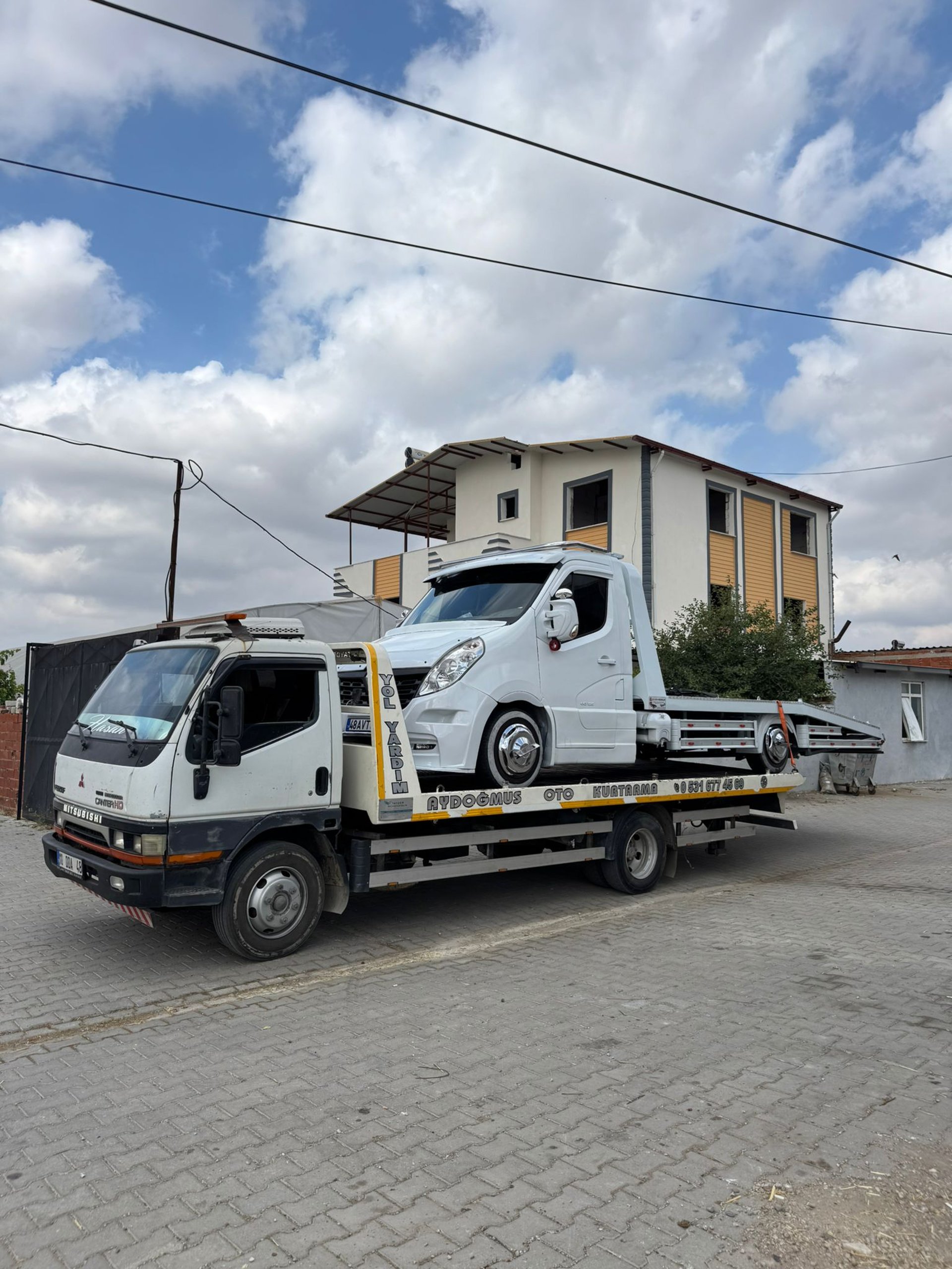 woman wearing yellow long-sleeved dress under white clouds and blue sky during daytime