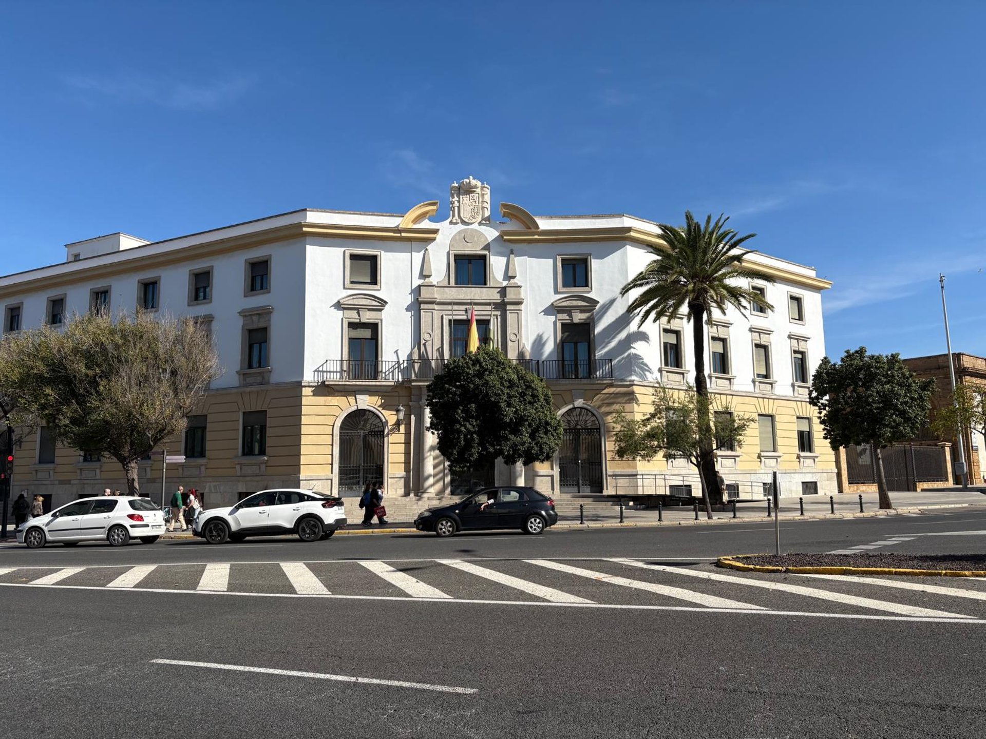 A classic building stands tall under a blue sky.