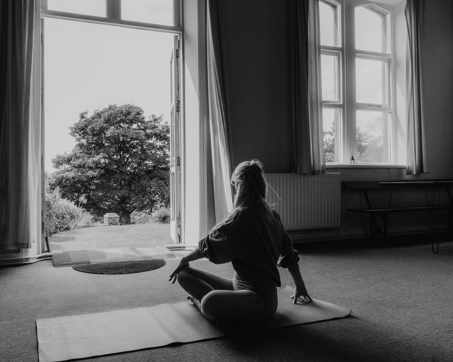 a black lamp sitting on top of a white wall