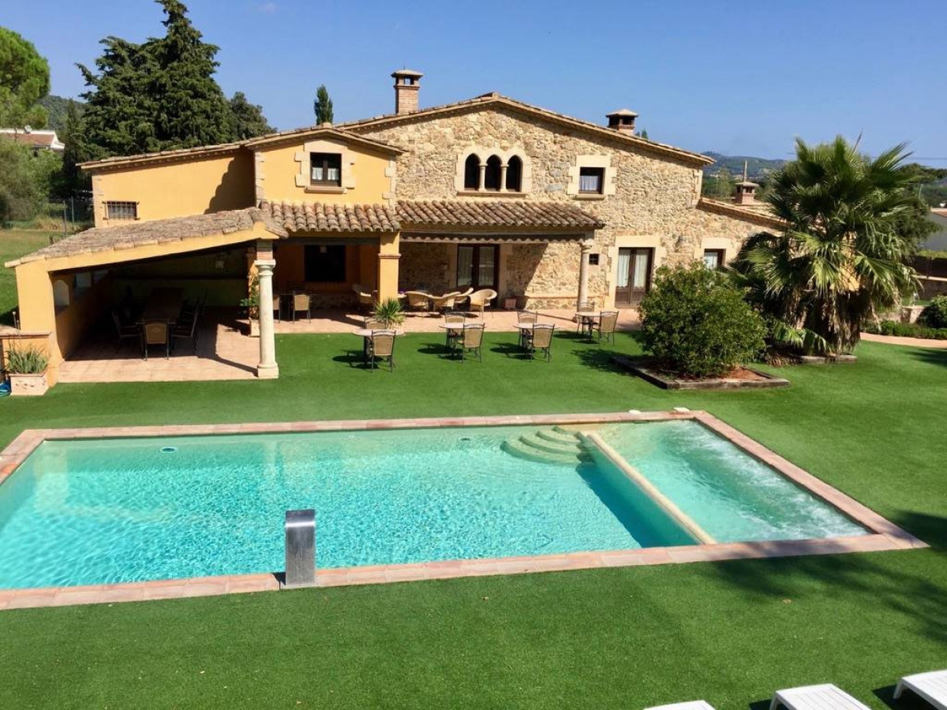 a black lamp sitting on top of a white wall