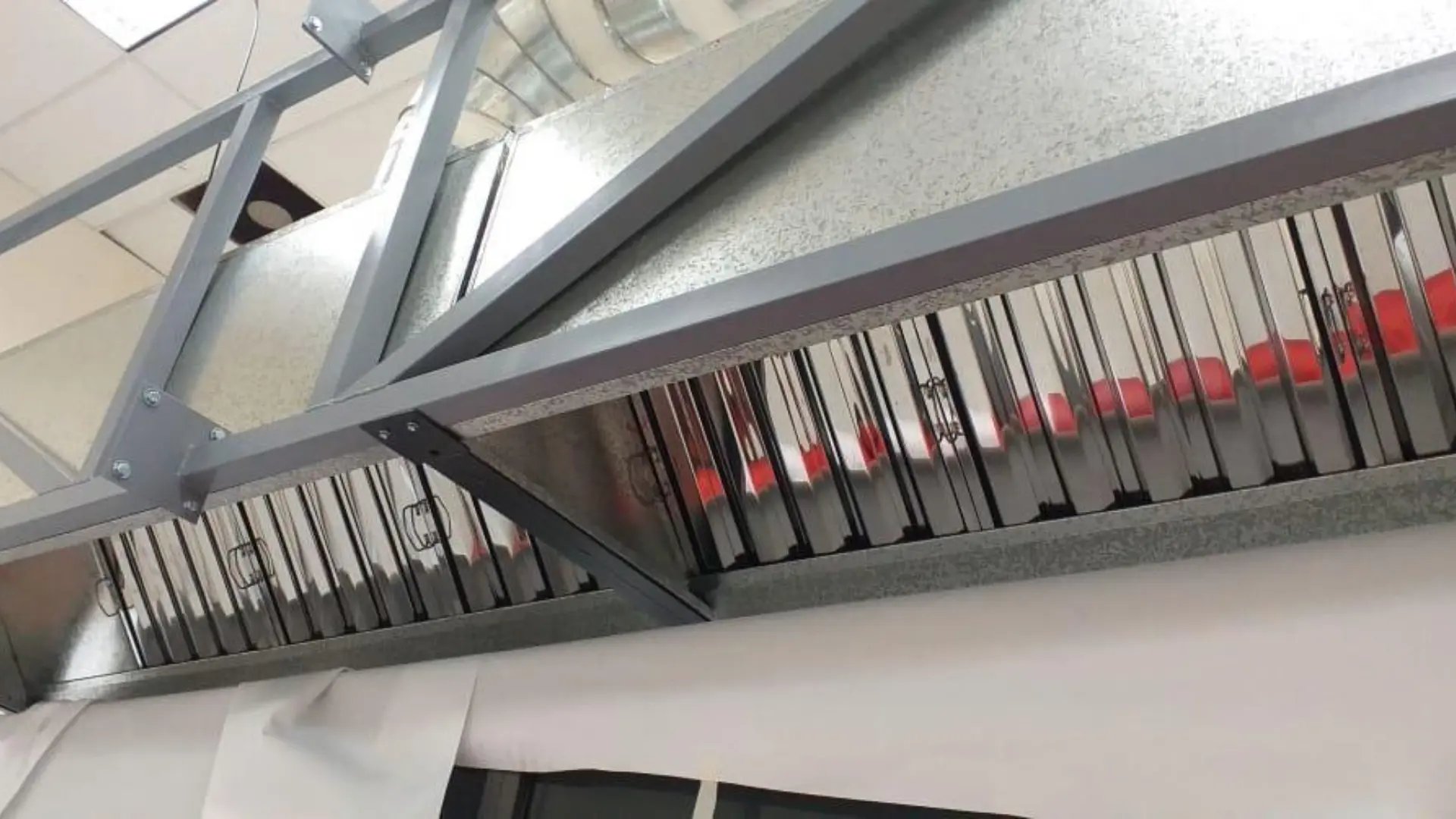 an abstract photo of a curved building with a blue sky in the background