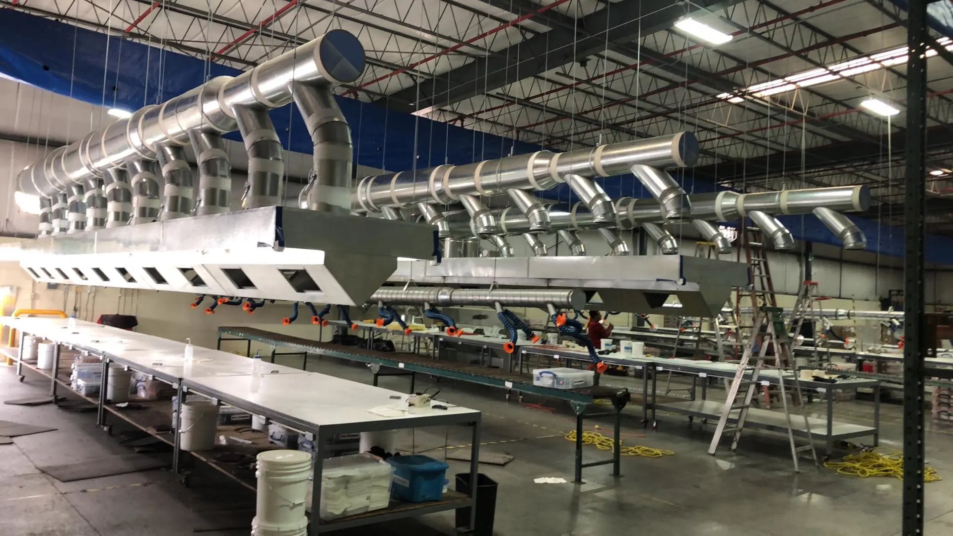 an abstract photo of a curved building with a blue sky in the background