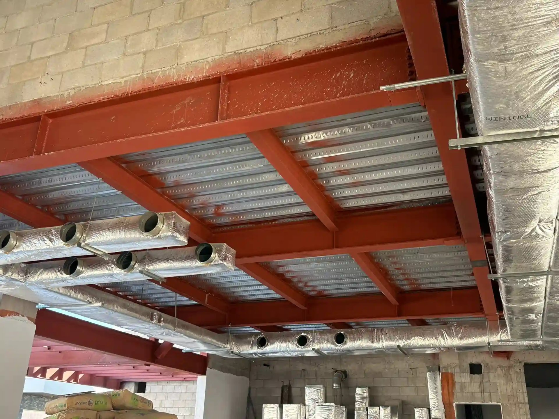 an abstract photo of a curved building with a blue sky in the background