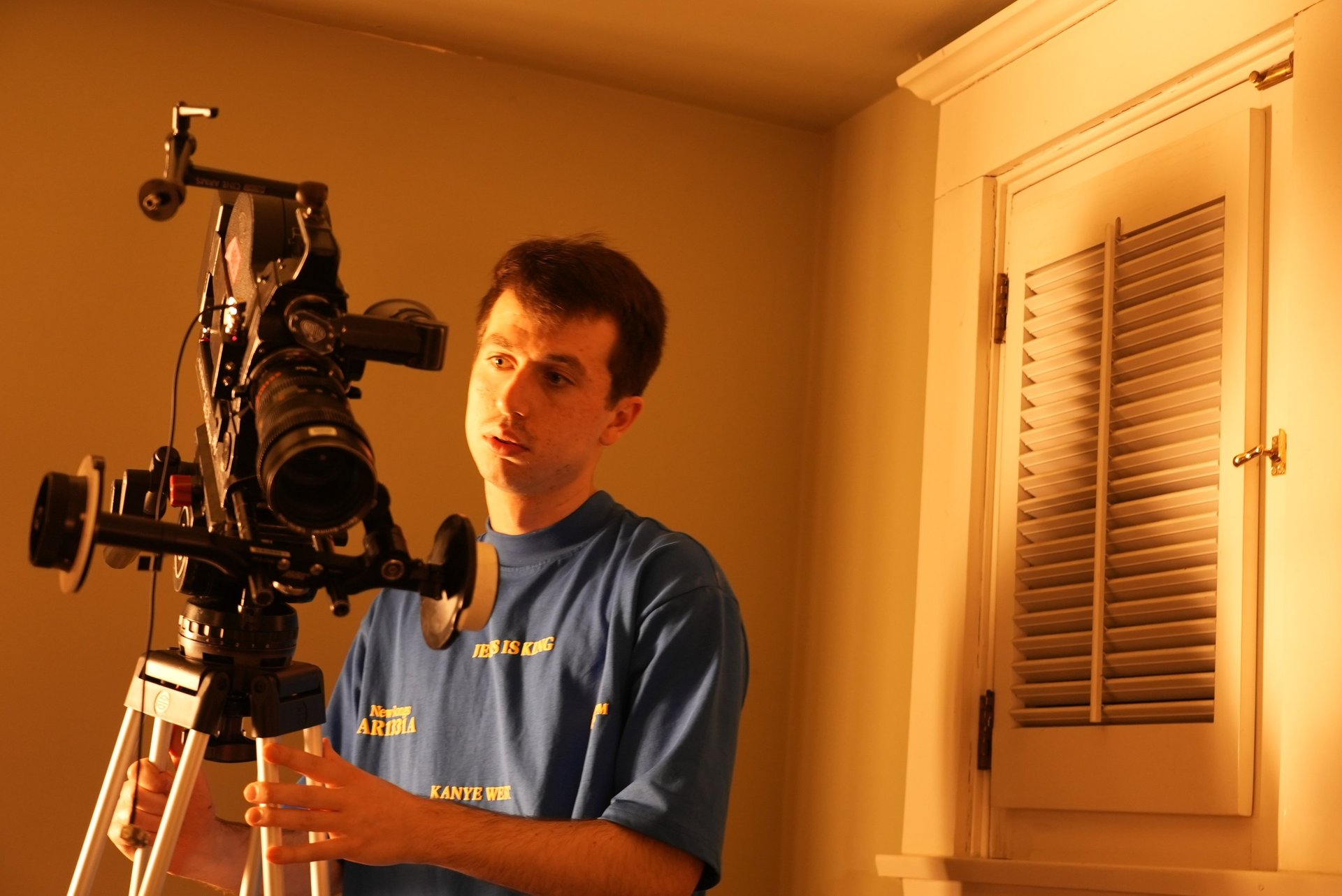 silhouette photo of man holding camera