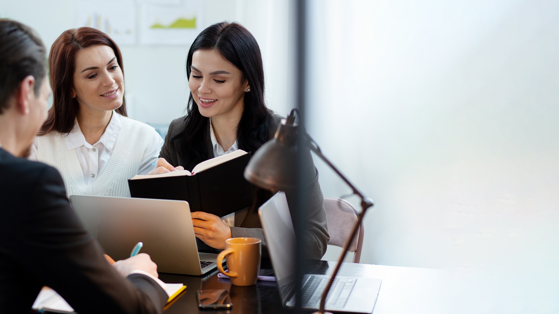 woman placing sticky notes on wall