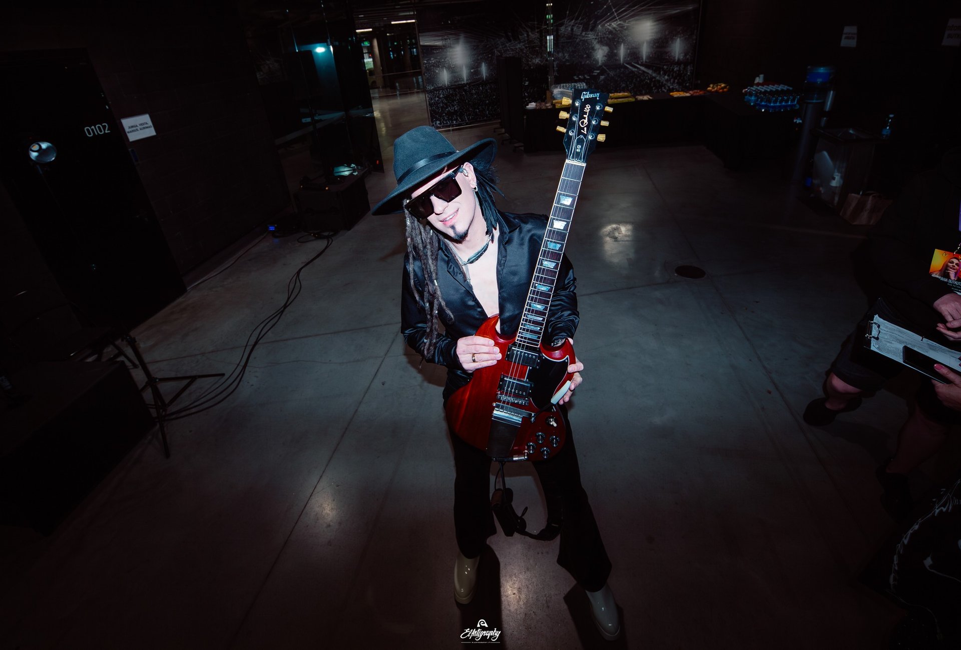 an abstract photo of a curved building with a blue sky in the background