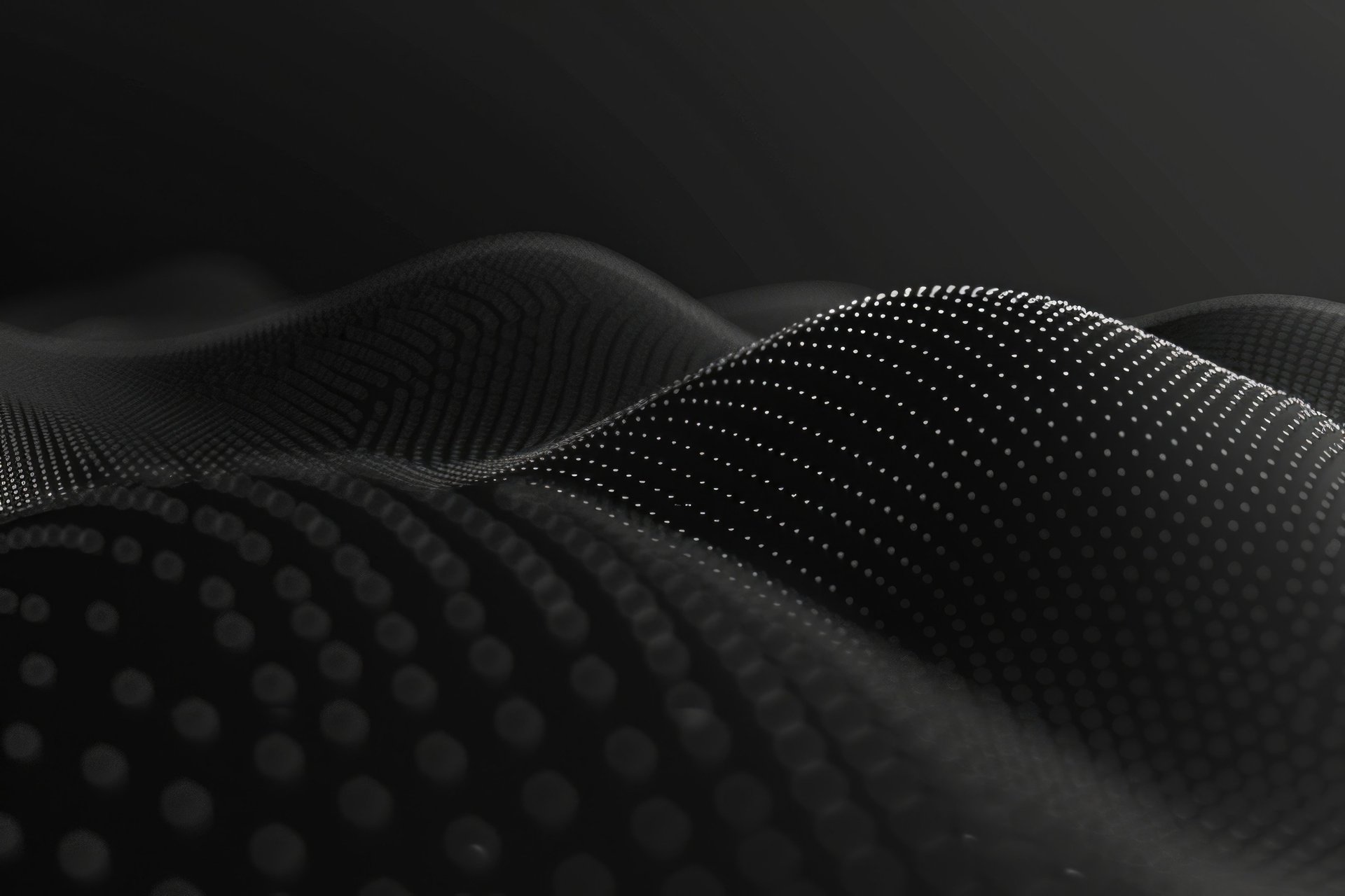 an abstract photo of a curved building with a blue sky in the background