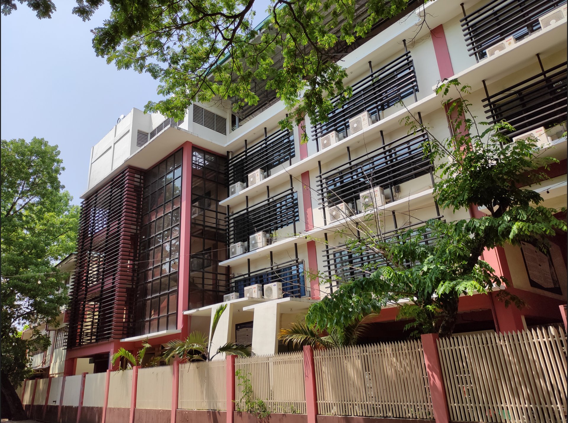 an abstract photo of a curved building with a blue sky in the background