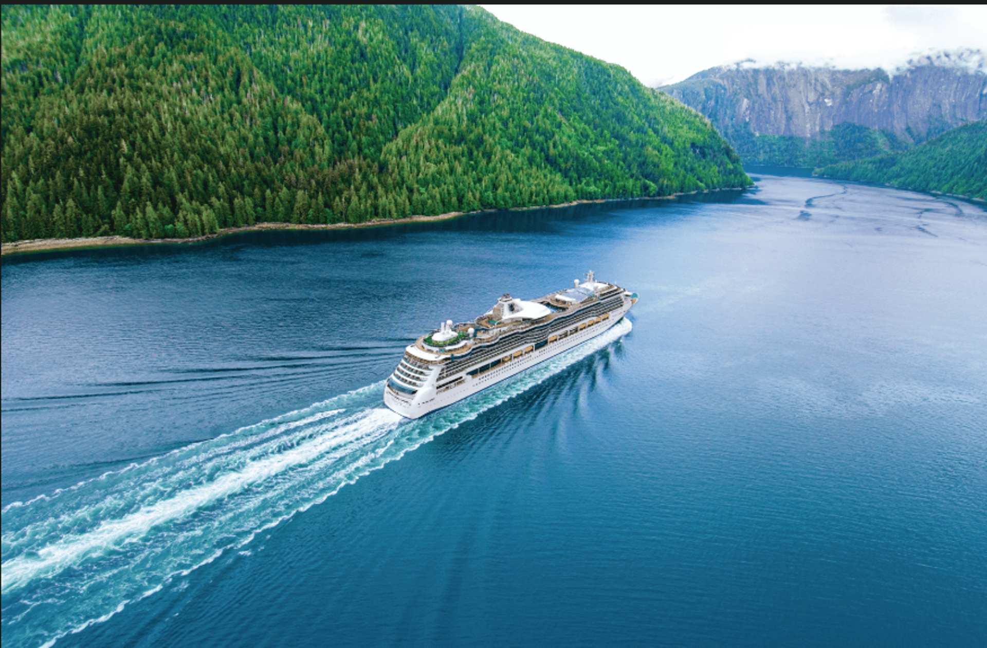 an abstract photo of a curved building with a blue sky in the background