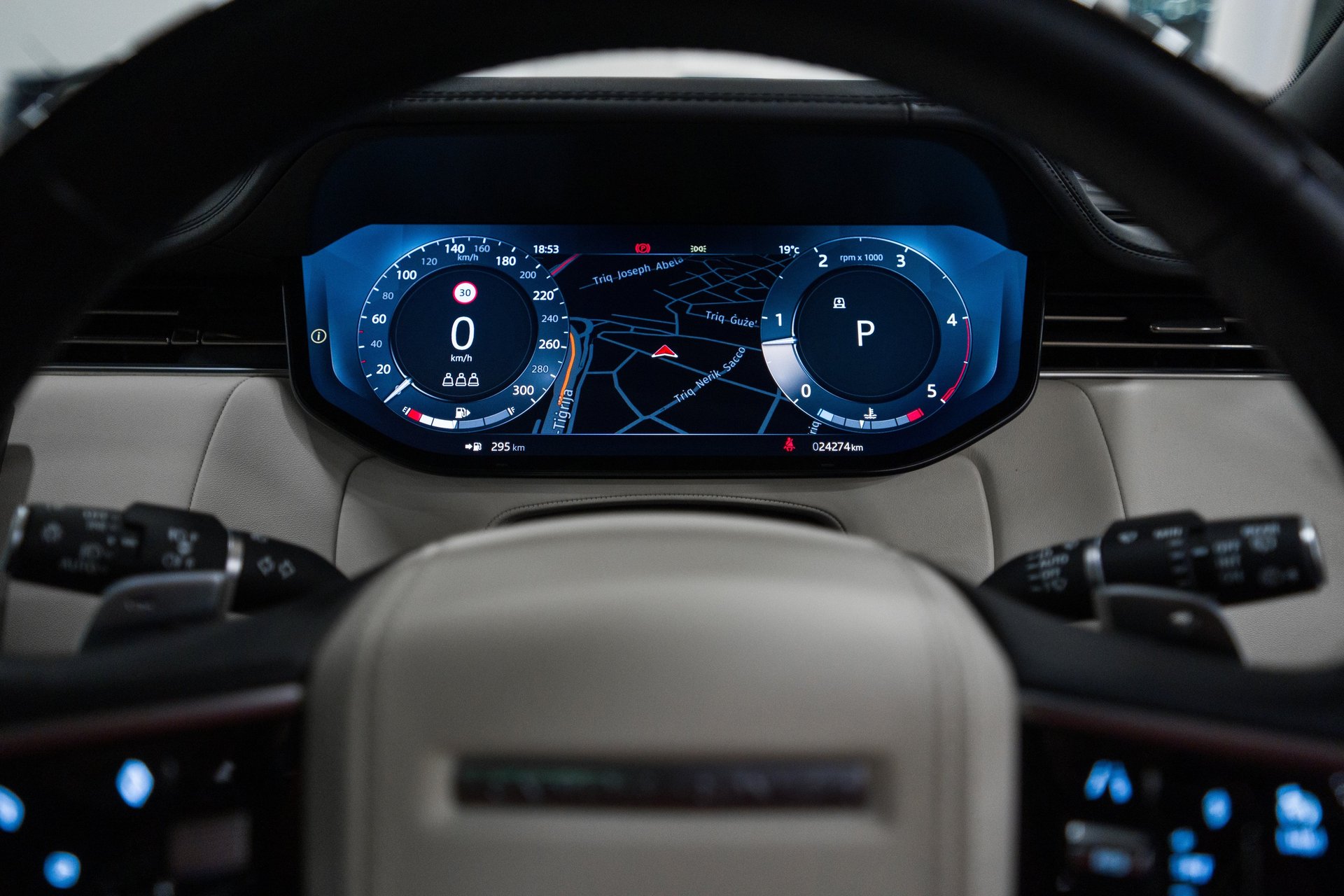 an abstract photo of a curved building with a blue sky in the background