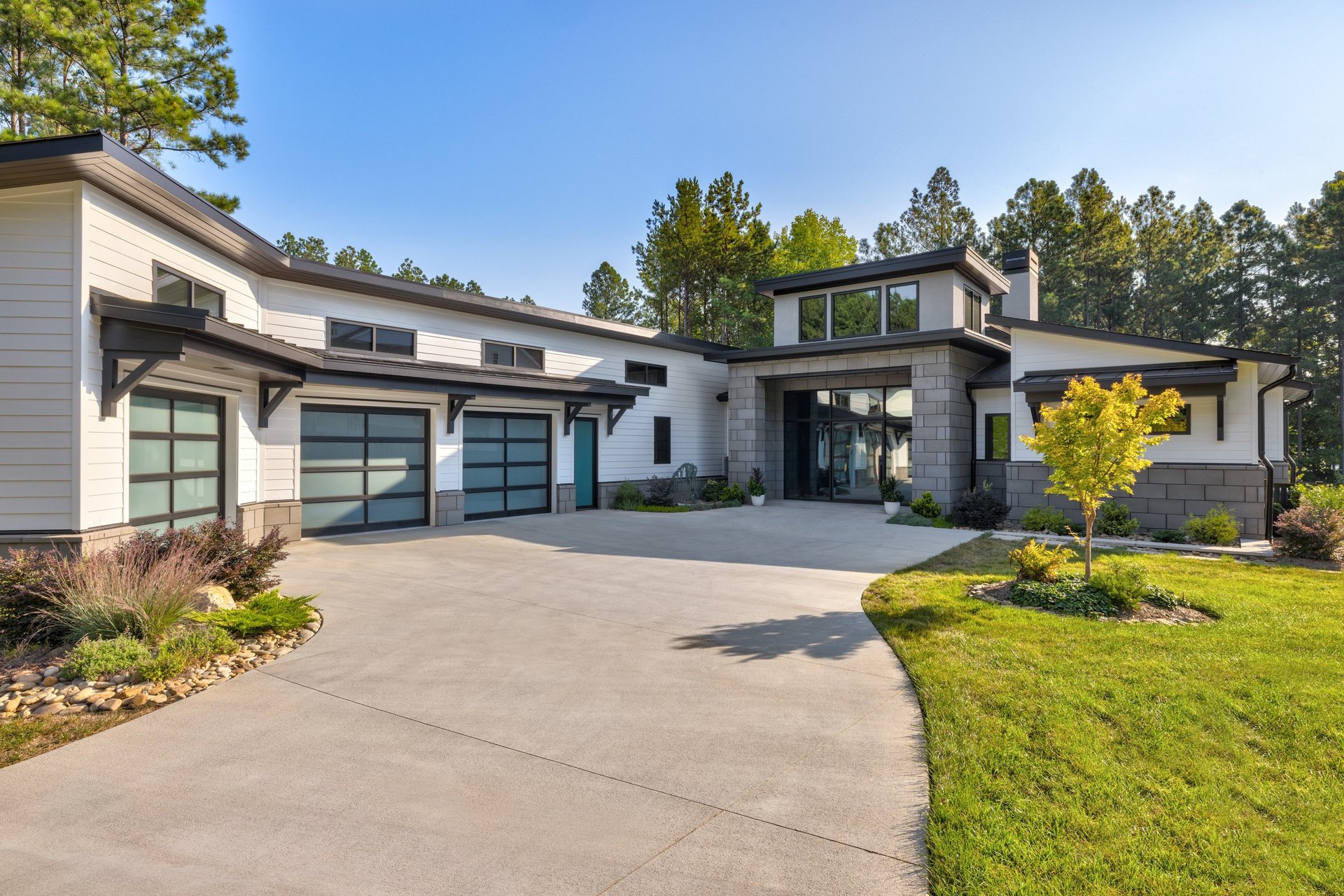 a modern house with a pool in front of it