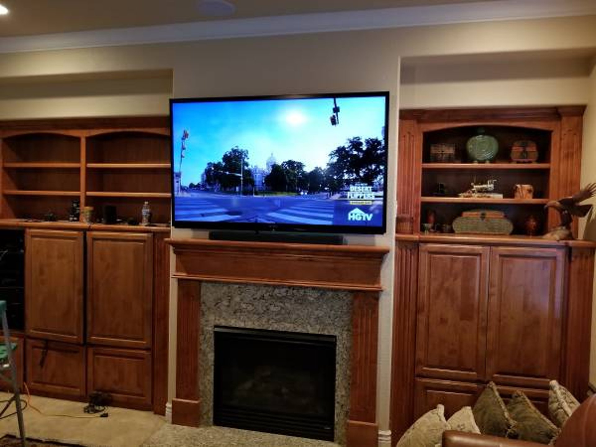 flat screen television on top of white wooden low-line TV stand