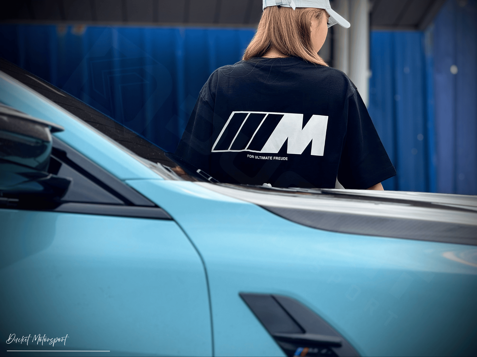 an abstract photo of a curved building with a blue sky in the background