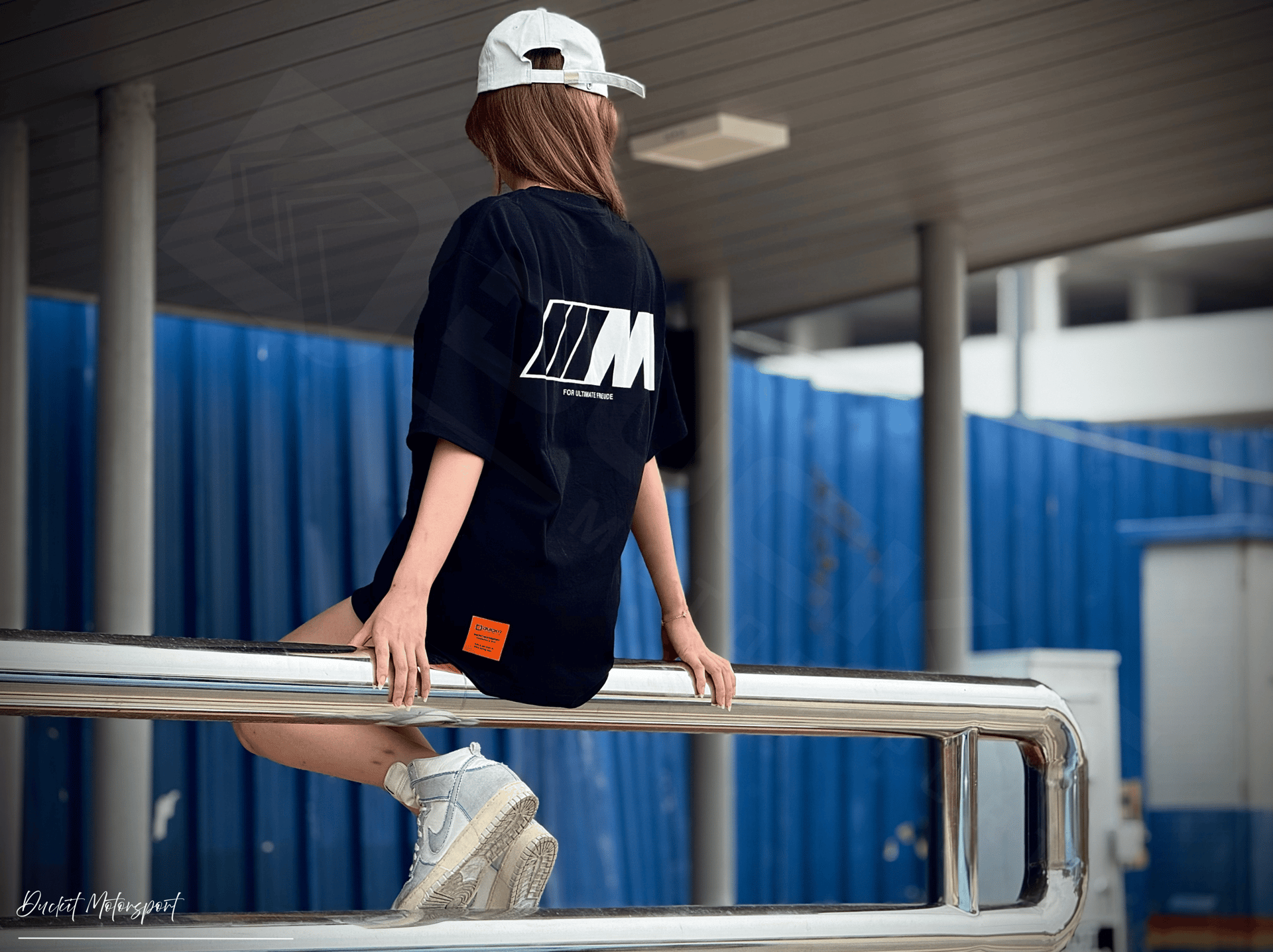 an abstract photo of a curved building with a blue sky in the background