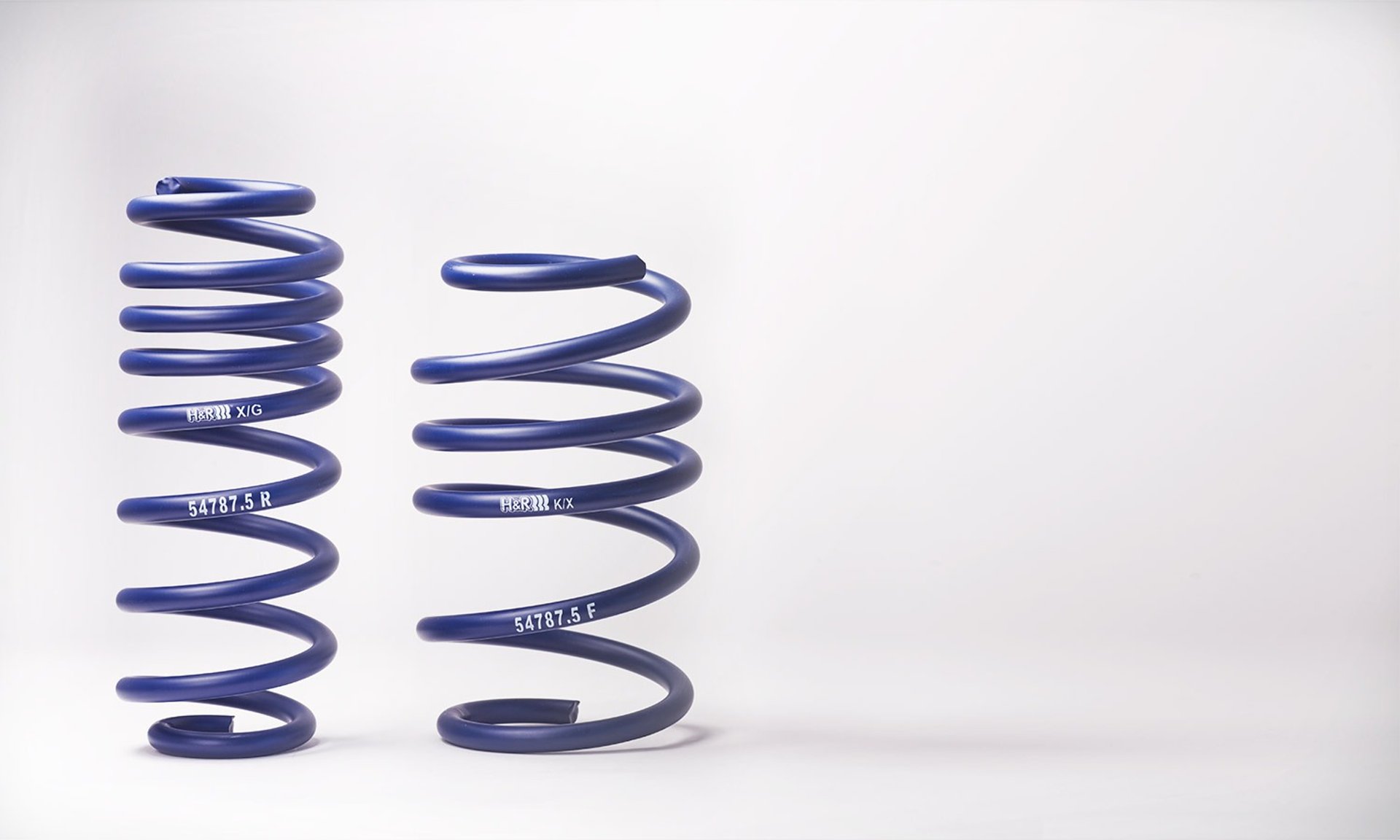 an abstract photo of a curved building with a blue sky in the background