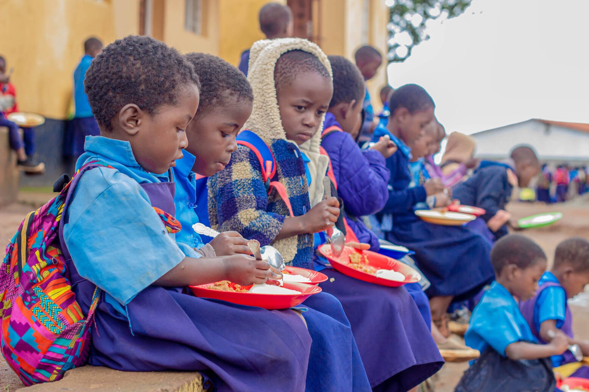 Children eating food in Malawi
