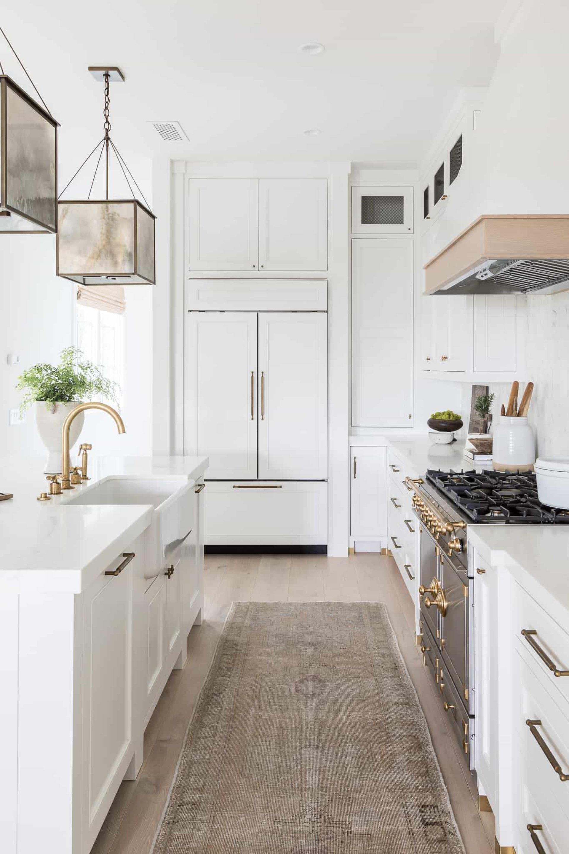 A kitchen with a wooden counter top and black walls